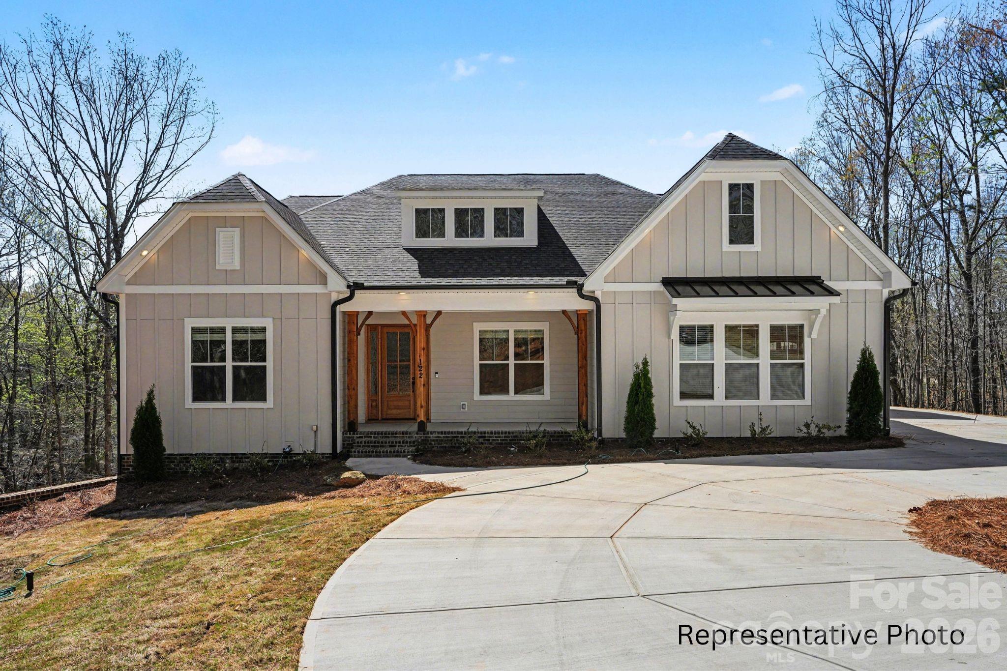 Discover luxury on nearly 2 acre homesite in the peaceful and picturesque community of Shepherds Trace. This NEW CONSTRUCTION 4 BR, 3.5 BA home blends refined design with everyday comfort, offering an open-concept layout ideal for both entertaining and relaxed living.

The Epicurean Kitchen steals the show with floor-to-ceiling cabinetry, quartz countertops, double wall ovens, and a large farmhouse island. It flows seamlessly into the Casual Dining area, complete with a serving station, sink, and wine fridge, and into the Family Room, where a coffered ceiling, modern fireplace, and abundant natural light create an inviting atmosphere. Step outside to the covered deck, perfect for year-round enjoyment.

The main-level owner’s suite offers a serene retreat with a trey ceiling, dual vanities, walk-in shower, spacious walk-in closet, and a bump-out sitting area for added comfort. Hardwood floors span the first floor (excluding secondary bedrooms and full baths), elevating the home’s warmth and style.

Upstairs, a generous Retreat/Loft provides flexible space for entertainment, hobbies, or relaxation, accompanied by the 4th bedroom and 3rd full bath—ideal for guests or multigenerational living.

Additional highlights include a 3-car garage, encapsulated and conditioned crawl space, and zoning for the highly regarded Clover schools. Closing cost contributions are available with the preferred lender, and additional homesites and plans are also offered.

This is the perfect blend of craftsmanship, comfort, and acreage living. Photos/video are representative of previous build of same plan and may show options that are upgrades and not scheduled to be included in this property, but could be available depending on contract date. Depending on contract date, some selections may  still be made from an extensive catalog offering multiple cabinet colors, quartz and granite countertops, hardwood flooring options, stone fireplace surrounds, and a wide range of tile finishes. Please confirm pricing, options, change availability, etc. with builder representative.