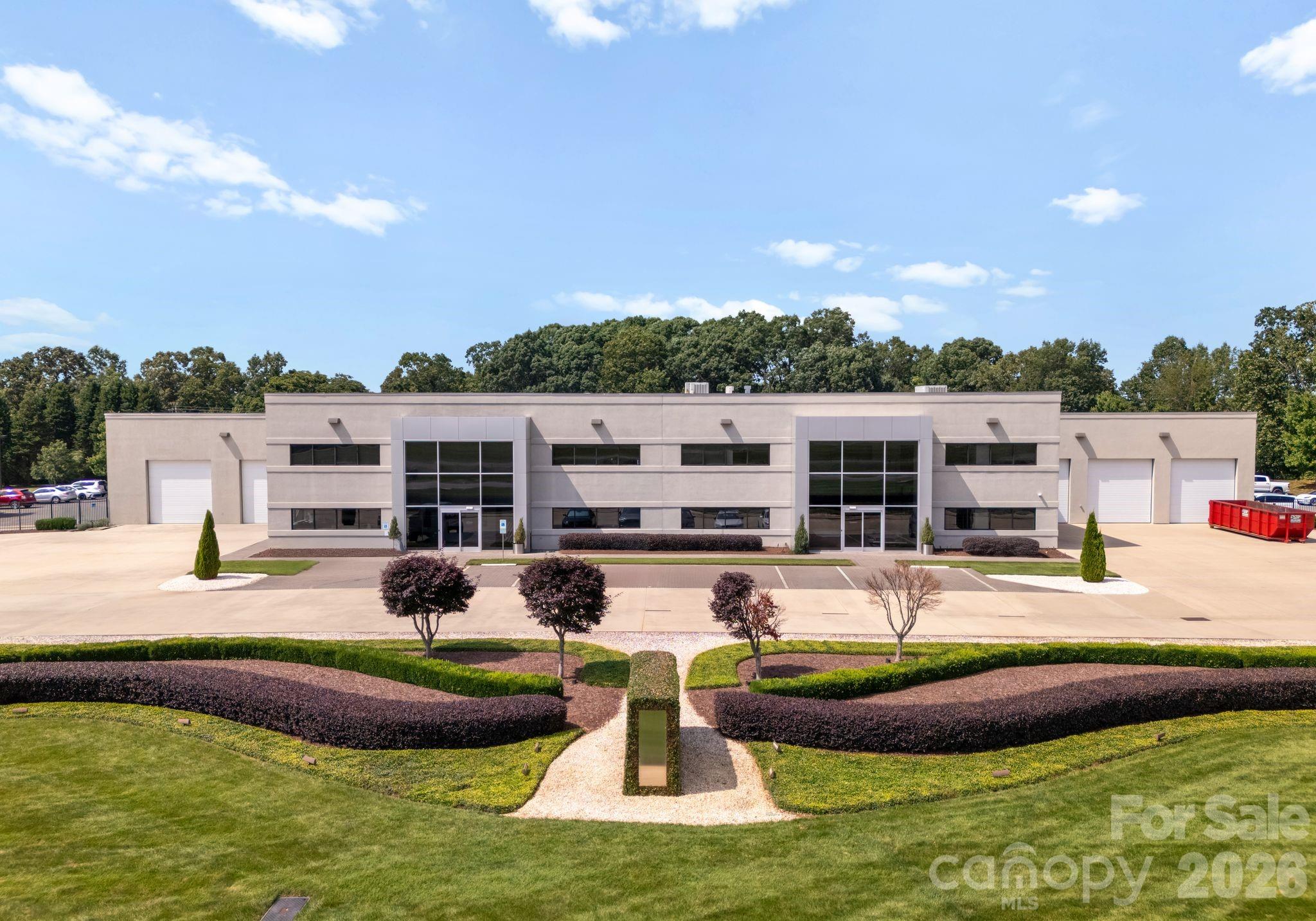 Class A Industrial Investment | Fully Leased to ADDMAN Group | ±74,000 SF | ±6 Acres | 6.56% Cap Rate

Outstanding single-tenant industrial investment opportunity across from Statesville Regional Airport. This ±74,000 SF Class A facility sits on ±6 acres and is fully leased to ADDMAN Group, a national leader in advanced manufacturing and metal 3D printing. The property features high-end office space, modern HVAC and electrical systems, and ample parking. Positioned just minutes from I-77 and I-40, in a rapidly growing industrial corridor. Stable in-place income with renewal options provides long-term security and value for investors.