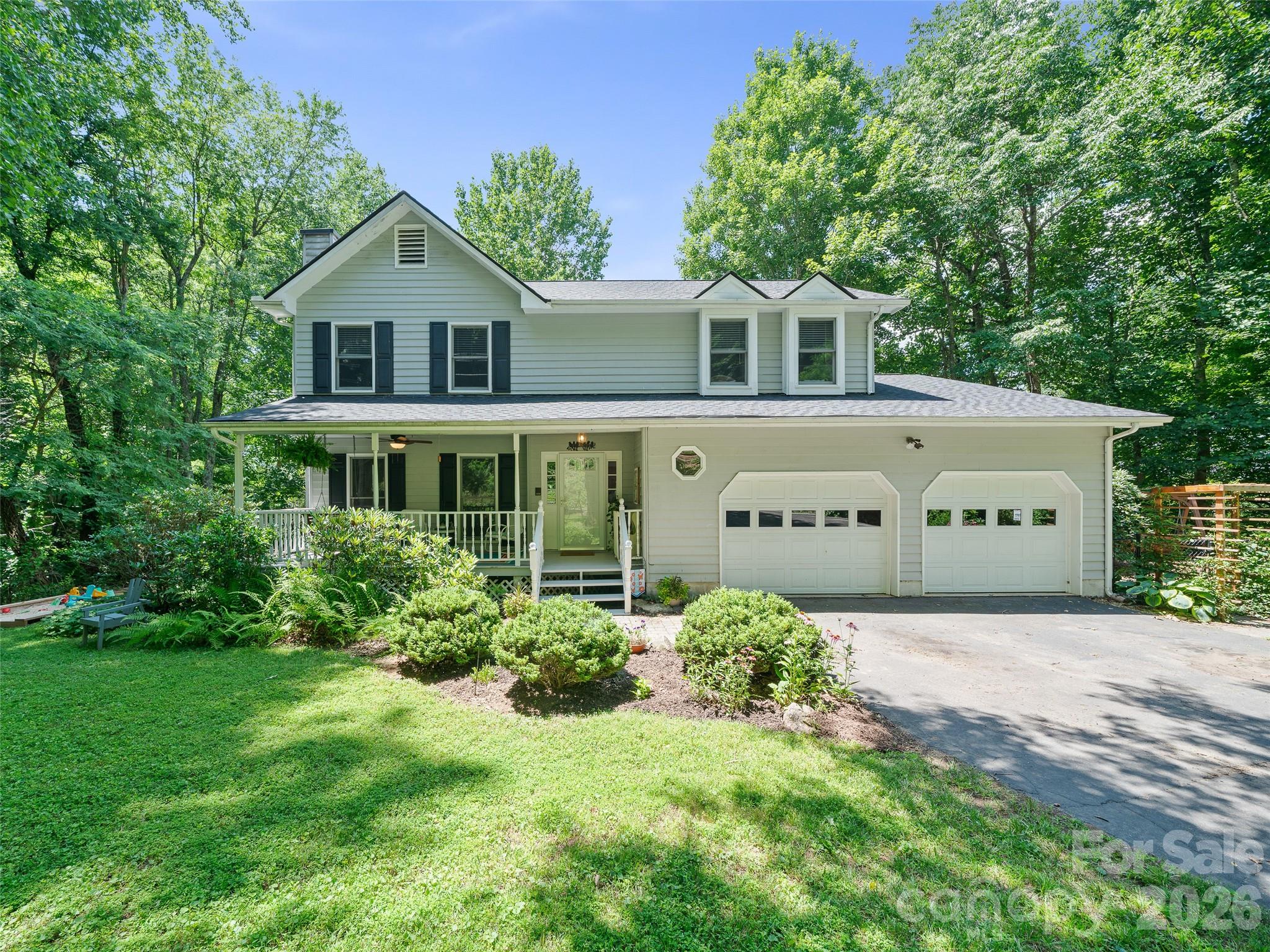 Within walking distance to the heart of Downtown Burnsville, 254 Shepard Way invites you to slow down, breathe deep, and take in the kind of long-range mountain views that never get old while still enjoying the conveniences of town living & easy access. This beautiful and cherished Modern Cape Cod style home has been thoughtfully designed to enjoy long-range mountain views from almost every room! From the moment you arrive, the covered front porch sets the tone—welcoming, timeless, and ready for everything from quiet morning coffee to rainy afternoon conversations. Step inside, and the home unfolds with intention. To the left, a sunken living room anchored by warm wood floors and a gas log fireplace creates a cozy retreat, flowing seamlessly into the dining area where sliding doors open to an expansive back deck—perfect for gathering, grilling, and soaking in the long-range mountain views. To the right, a spacious family room with a bay window captures natural light and mountain vistas, blending effortlessly into the open kitchen. Here, thoughtful design meets everyday function with generous storage, a U-shaped layout, and a window perfectly positioned to frame the landscape beyond. Whether you're cooking, hosting, or simply enjoying a quiet evening, this space keeps you connected to both home and horizon. Upstairs, the primary suite becomes your private escape—spacious, serene, and complete with a sitting area and its own deck overlooking the mountains. The ensuite bath offers a daily retreat with a soaking tub complete with a large picture window, inviting you to unwind while taking in the mountain views. A smart split-bedroom design provides privacy for guests or family, with additional bedrooms—one featuring its own private deck—positioned to capture that same breathtaking backdrop. Function meets flexibility with a spacious laundry room located on upper level, abundant storage including a floored attic, and a two-car garage—all designed to make everyday living feel effortless. Outside, thoughtfully planted perennials bring color and ease to the landscape, while the .7-acre lot offers just the right balance of space and simplicity. Additional fenced space in the side yard is ideal for pets or recreation while still allowing enjoyment of the mountain scenery. And perhaps the most compelling feature of all—you're just a short walk or drive to downtown Burnsville, where local charm, dining, and community await. If you're seeking a home with front-row seating to the mountains, wrapped in comfort, convenience, and timeless design - 254 Shepard Way has everything you'll love & more! Don't miss out on this rare & unique opportunity to own this spacious home with long-range views in town!