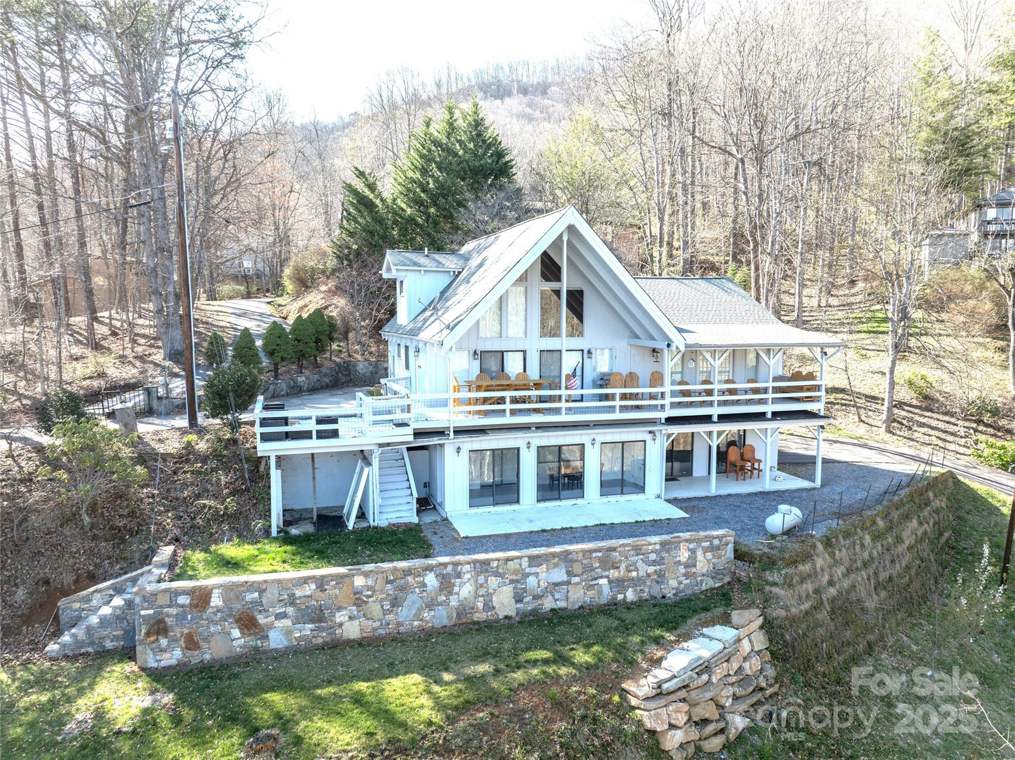 Beautiful spacious home in desirable Maggie Valley Country Club Estates above the Maggie Valley Country Club and Resort. Beautiful 18 hole golf course and country club a5 minutes from your front door. Close to shopping and Waynesville. Less than half an hour to Harrah's Casino. Close to the Great Smoky Mountain National Park. The home has a 2nd living area on the lower level. This home can accommodate a large family. The roads are all paved in this subdivision.