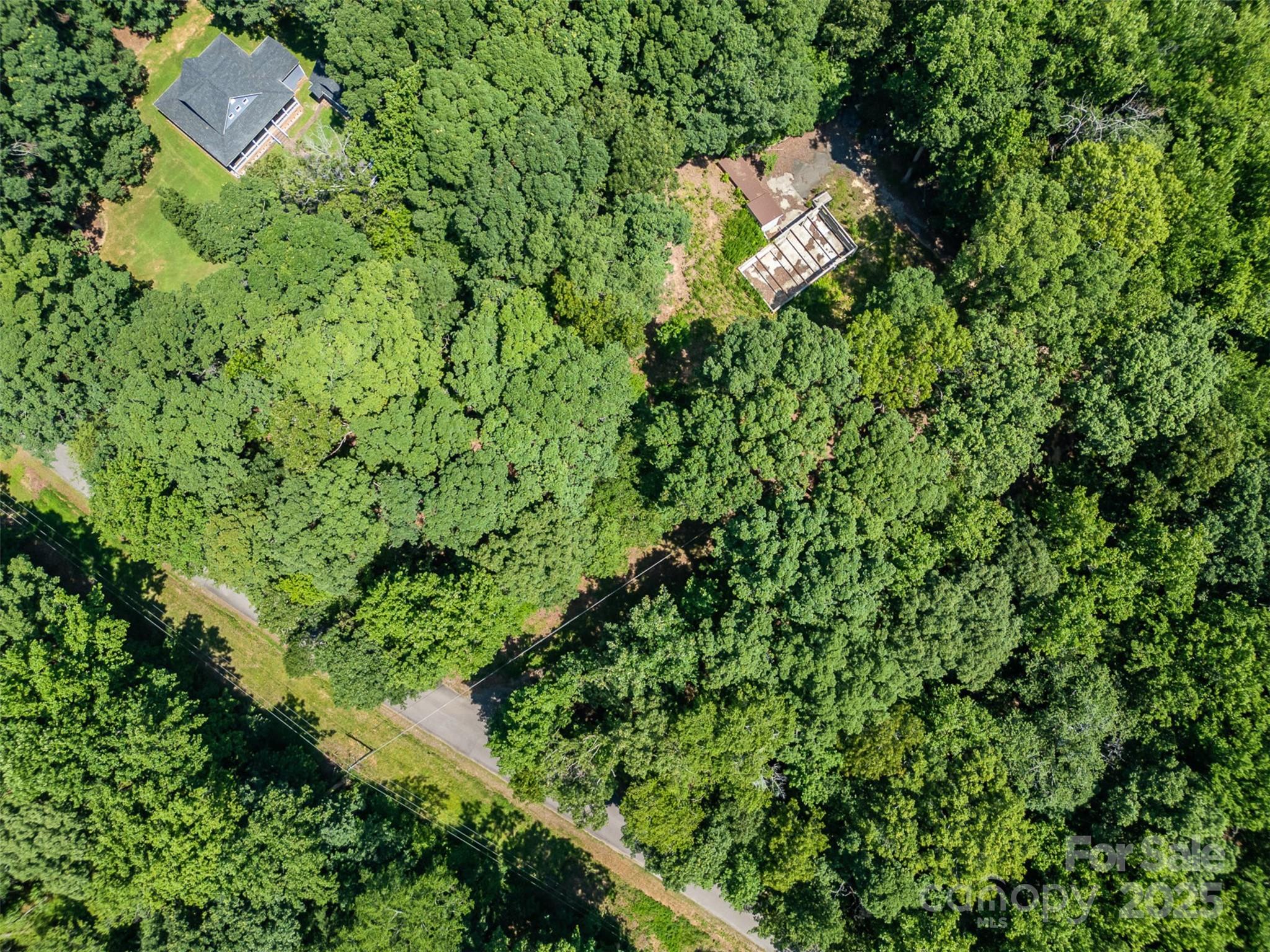 Your future retreat just got even better. Now offered at $175,000, this 4-acre gem on a quiet cul-de-sac off Hwy 161 between York and Clover is the perfect blend of privacy and possibility. Towering hardwoods create a serene backdrop, while build-ready essentials are already in place: a permitted 4-bedroom septic, private well, gated driveway, and a spacious storage shed with a metal roof and 240 Volt RV hookup. An engineered, architect-approved cement-block foundation is ready to become whatever you imagine—garage, workshop, or the base of your dream home. With no HOA, no flood concerns, and even subdivision potential, your options are wide open. Just minutes to Lake Wylie, Rock Hill, and Clover’s shops—and under 30 miles to Uptown Charlotte—this is a rare opportunity to create the lifestyle you’ve been dreaming of. Ready to take a closer look? Your future retreat is waiting.