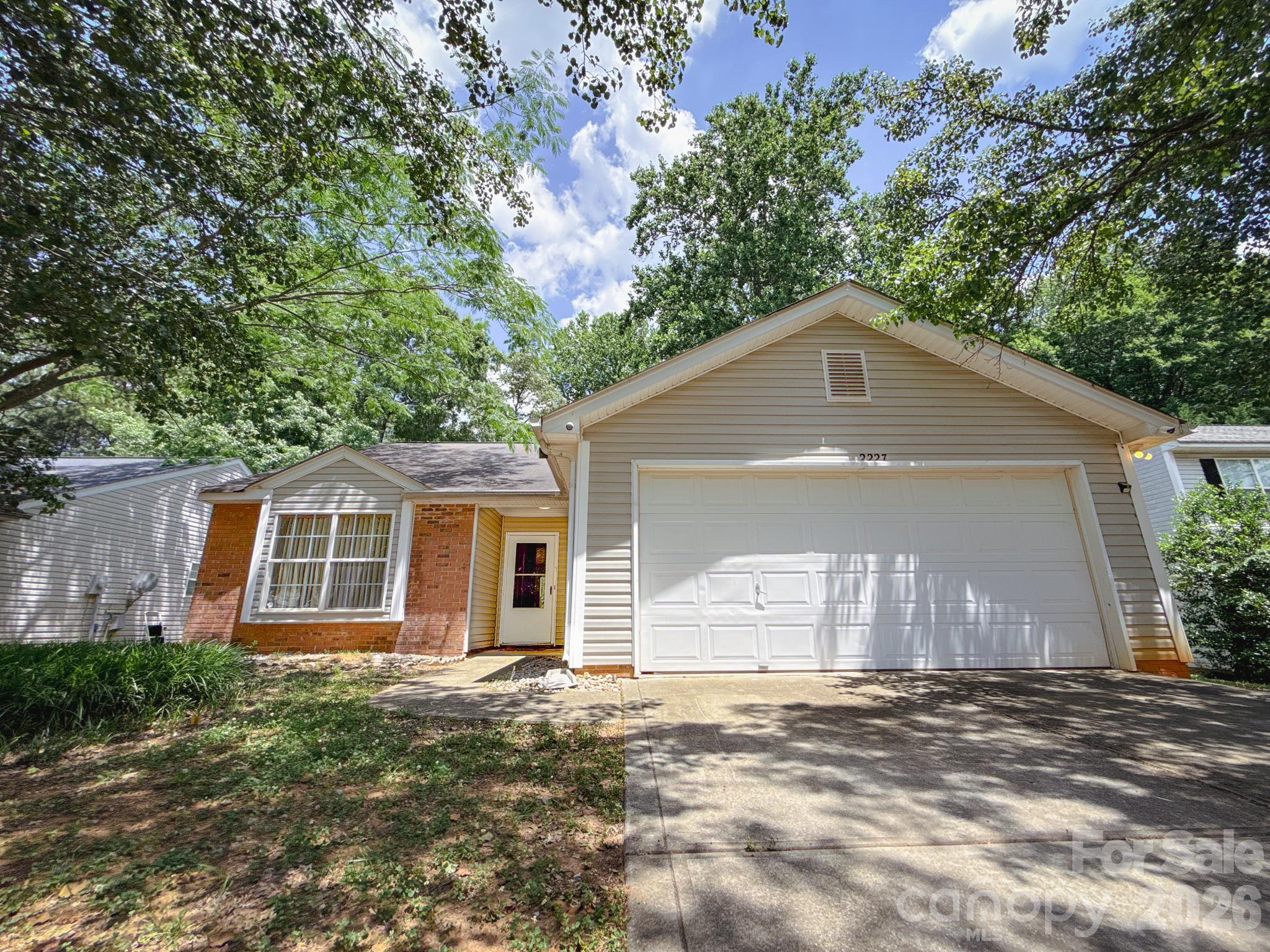 Tucked in the quaint Barron Estates community, this charming ranch offers relaxed living in desirable Rock Hill—minutes to shopping, dining, and quick access to Charlotte. Step inside the open living room with vaulted ceilings and a cozy gas-log fireplace, creating a warm centerpiece for gatherings. The kitchen offers stainless steel appliances, refrigerator with ice maker, great storage and counter space. Split Bedroom layout giving owners suite and others their own privacy.  Large primary includes ensuite bath and walk-in closet. Secondary bedrooms and full hall bath is excellent for guest use. Spacious laundry/mud room connected to garage. New HVAC system. Outdoor features include Rear Patio and Privacy Fence. Move-in ready and conveniently located—schedule your showing today!.