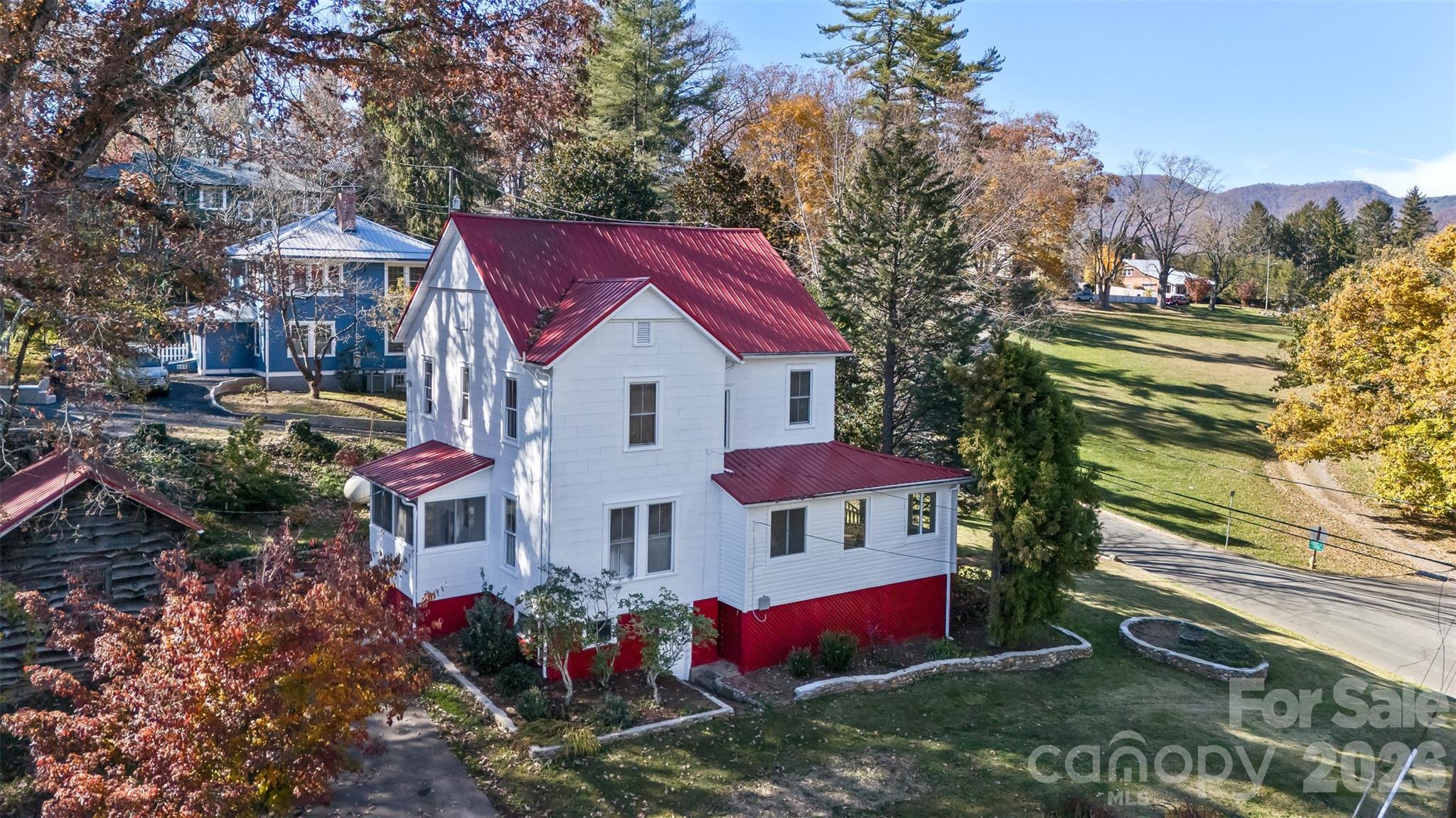 Timeless 1919 Victorian farmhouse offering a blend of historic character and thoughtful updates. Seller is offering a $15,000 credit toward additional updates or improvements.

This well-maintained home features a covered front porch and combines original charm with modern updates. The interior and exterior have been freshly painted, complemented by refinished original hardwood floors and updated windows throughout.

The kitchen features custom concrete countertops, ample cabinetry, and included appliances. A formal dining room provides additional space for everyday use or entertaining.

The living room offers high ceilings, built-ins, and a gas fireplace. A sunroom adds flexible living space with abundant natural light and year-round usability.

Upstairs includes four generously sized bedrooms suitable for a variety of uses such as guest rooms, office space, or hobbies, while maintaining original architectural details and craftsmanship throughout the home.

Exterior features include mature shade trees, established landscaping, stone accents, a backyard patio with built-in BBQ, fenced area for pets, rear parking access, and a detached workshop with electricity, suitable for storage, hobbies, or projects.

Additional features include city water and sewer, propane furnace, and an unfinished basement offering storage and future potential.