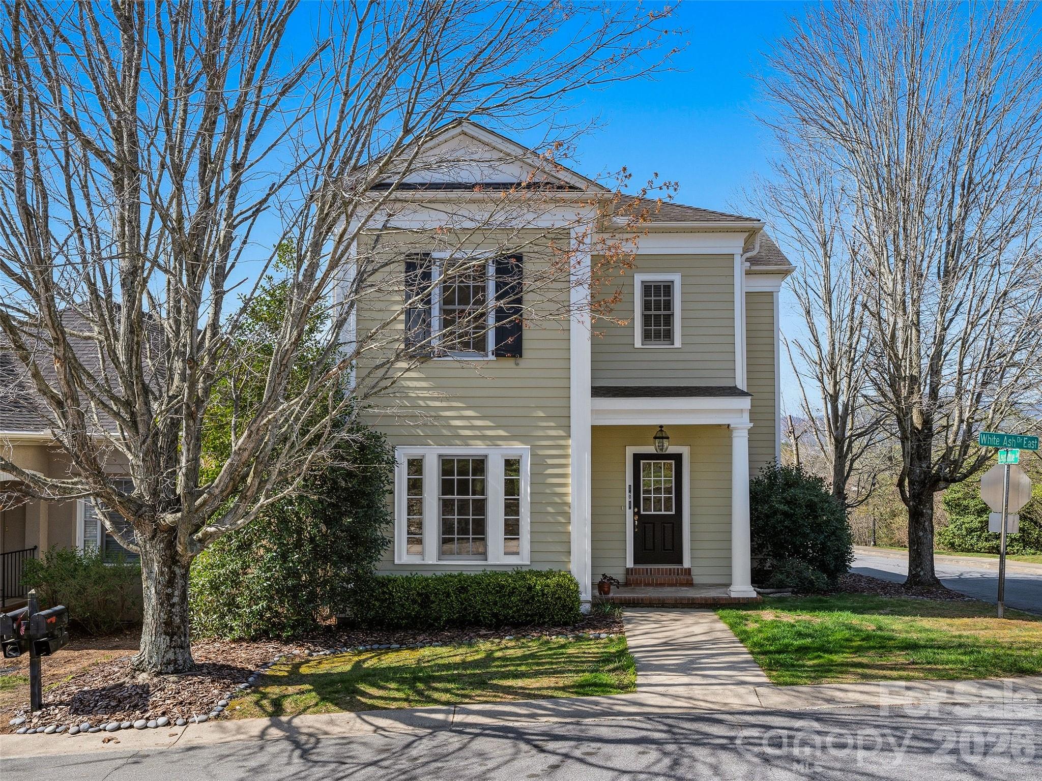 Home Warranty provided by Seller. New roof installation 5/26-30. Interior & exterior paint is 2 years old. New AC unit installed 5/21/26. Hot water heater & dishwasher are 2 years old. This beautiful home is located in the highly sought-after Biltmore Park community, one of Asheville's most walkable & vibrant neighborhoods. Ideally located on a corner lot, this charming two-story residence blends comfort, style, & convenience minutes from Town Square where you'll find cafes, restaurants, shops, a movie theater, and the YMCA. Inside, there is 1,700+ square feet of thoughtfully designed living space.The main living area features beautiful hardwood floors & a cozy gas-log fireplace; the kitchen shines with granite countertops, built-in features, & ample cabinetry.Upstairs, spacious bedrooms provide comfortable retreats, including a primary suite with a walk-in closet & spa-like jet tub ideal for unwinding after a long day.Step outside to enjoy a fenced yard & rear porch perfect for morning coffee. Exceptional amenities include community pools, tennis courts, walking & jogging trails.