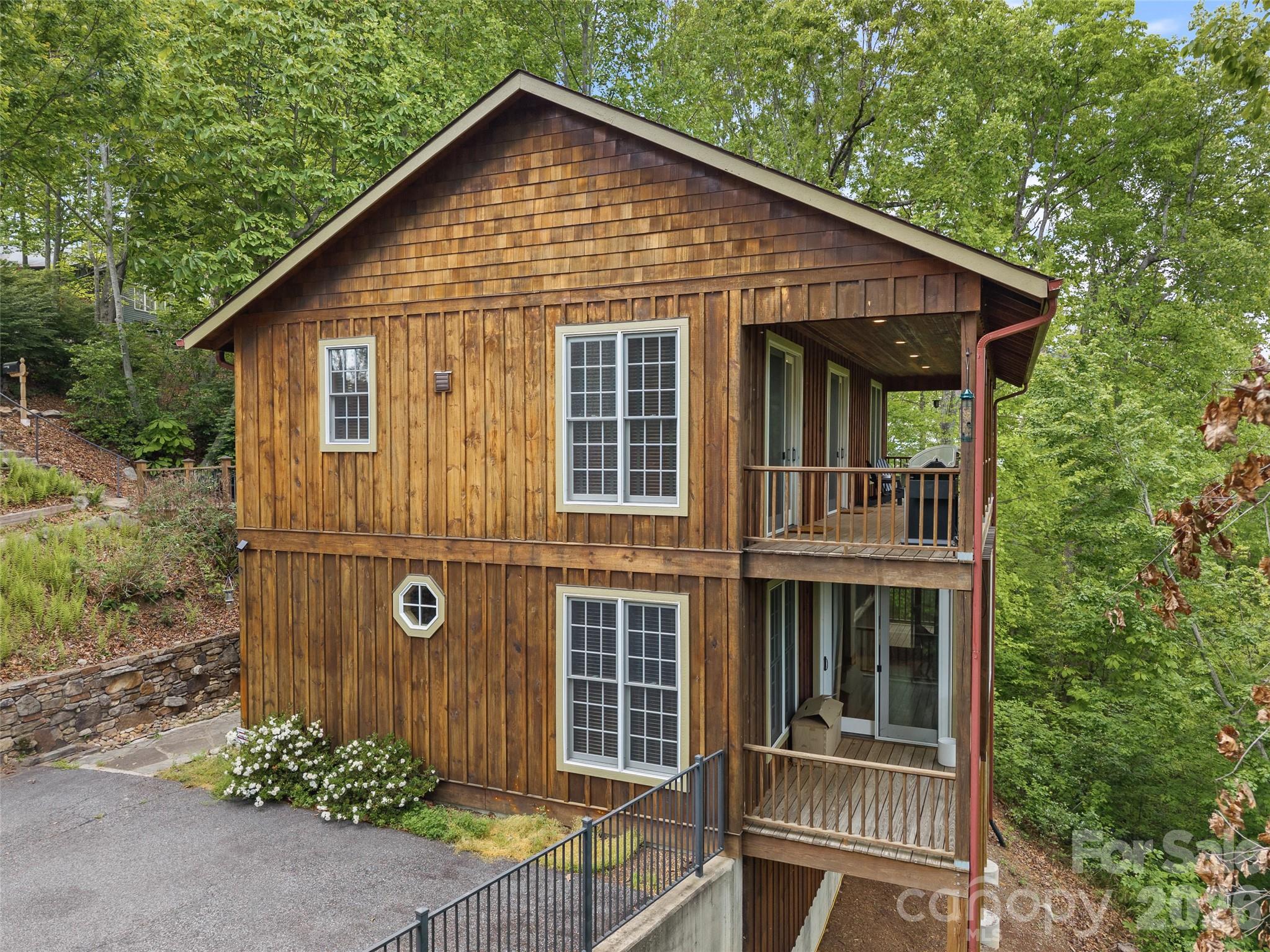 High quality custom built home with views and walkable to downtown Saluda. 
Many custom features, including closed cell foam insulation for outstanding energy efficiency and enhanced structural integrity on exterior and open cell foam on interior walls. Gorgeous oak floors. 
Three private bedrooms each featuring ensuite baths and deck looking at wooded seasonal mountain views. Trim the trees on your nearly 2 acre property to improve the year round view. The build quality of this impeccably maintained property is unmistakable. 
Perfect for investment as a rental, vacation property or your new permanent home.