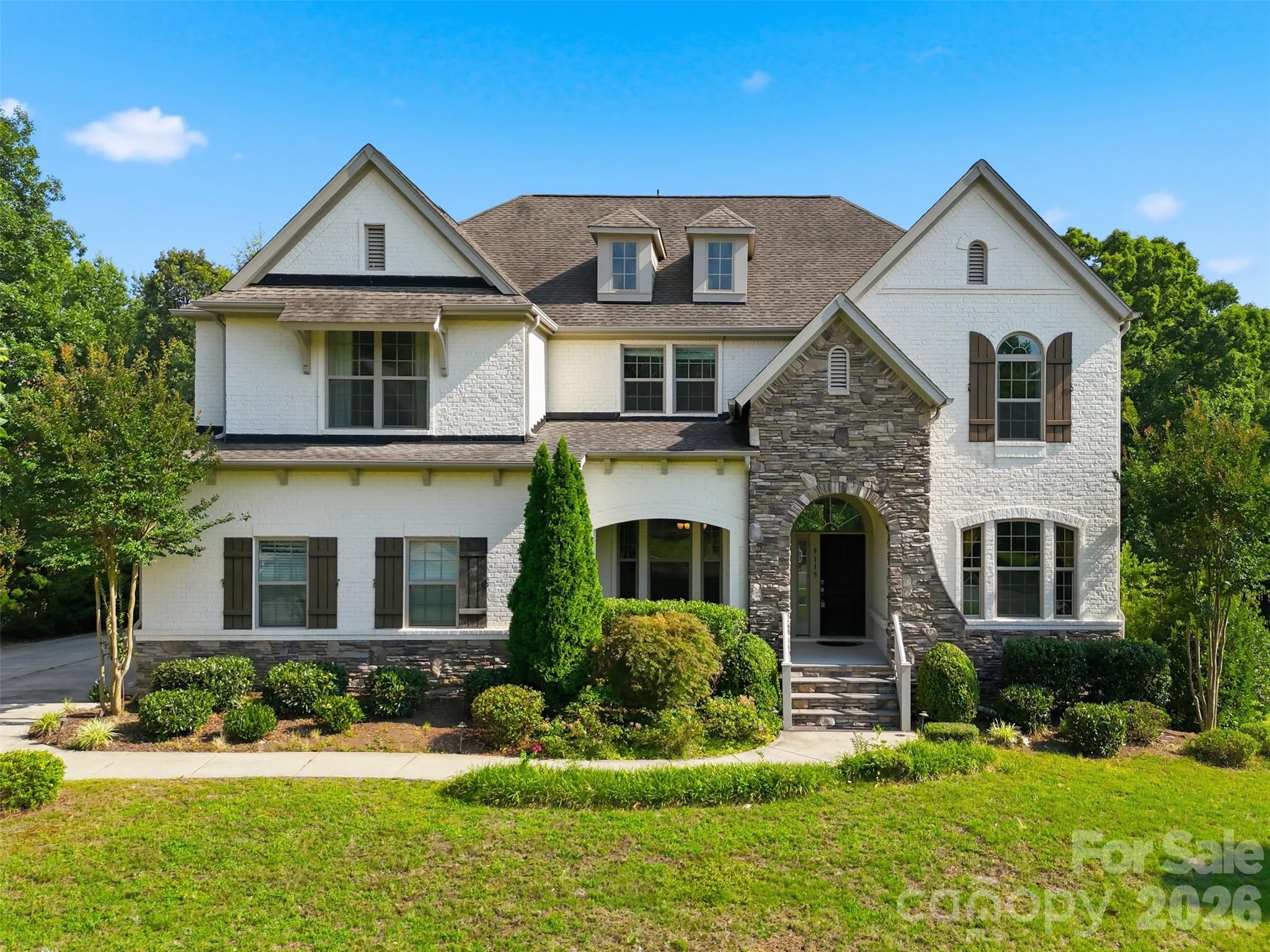 Beautiful open concept home in popular gated Providence Downs. Gorgeous kitchen with huge island, granite, ample cabinets, designer backsplash, gas cooktop, and farmhouse sink. Convenient home office or guest space on main floor with full bathroom attached. Master and three additional bedrooms on second floor with spacious closets. Upstairs laundry adds to the convenience. Large bonus/media room and a retreat for entertaining. Lovely Great Room with 12 foot ceilings and fireplace. A quiet sunroom is tucked away in the open floor plan. Outdoors there are two large porches, screened and unscreened. Extra space in the oversized 2.5 car garage can be used for additional storage. Established community with a pool, clubhouse, fitness facility, tennis courts, basketball courts, and walking trails! The home’s elementary school assignment even has the incredible Mandarin Immersion option. Low Union County taxes. Close to Waverly, Blakeney, Ballantyne, and Stonecrest.