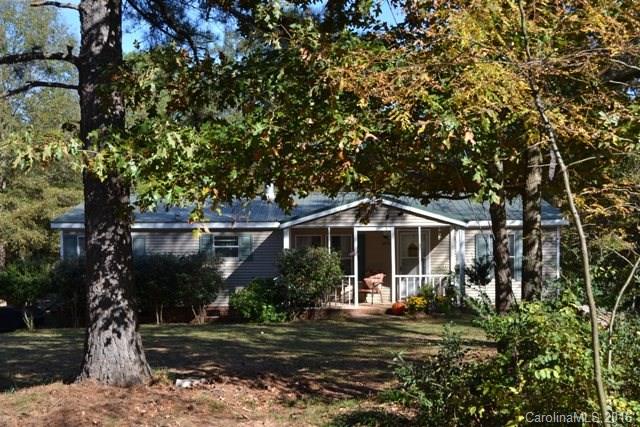 Come stretch your legs and bring your horses to this 5.6 acres.  There are two stall and wired barns and a detached wired building.  Some fencing for the animals.  The home offers 3 bedrooms, 2 baths, great room with fireplace.  Spacious kitchen has a work island, dishwasher, electric range and refrigerator.  Plenty of room to roam - inside and outside.  Tin roof is approximately 4 years old.  BA to confirm schools.