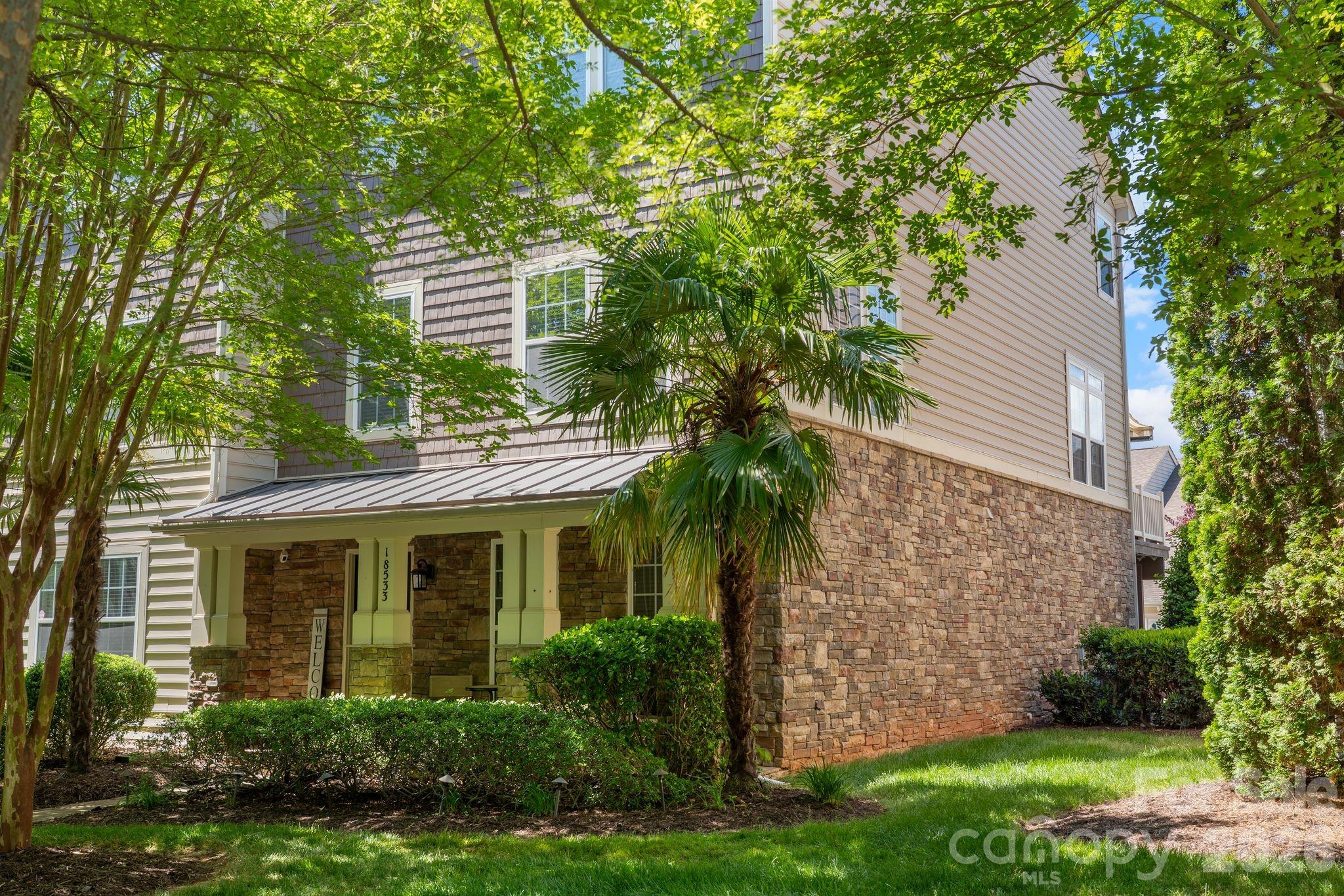 FHA 2.75% ASSUMABLE LOAN!  Beautiful end-unit townhome with plenty of natural light & perfectly situated in the heart of Cornelius, just four doors down from the community pool! This move-in-ready home features hardwood floors throughout most of the main areas, new carpet in the bedrooms & bonus room.  New HVAC system (2022). The interior boasts updated bathroom sinks, mirrors, and lighting, plus a bright kitchen with white cabinets, granite countertops, and a tile backsplash.  Ring security system

Enjoy outdoor living on the new composite deck with an automated retractable awning, ideal for relaxing or entertaining. Additional highlights include a 2-car garage, a wide, extended driveway, 3 bedrooms, 2 full baths, and 2 half baths.

Conveniently located within walking distance or a short ride to popular shops, restaurants, Lake Norman, and Birkdale Village, this home offers a perfect blend of comfort, style, and location.
