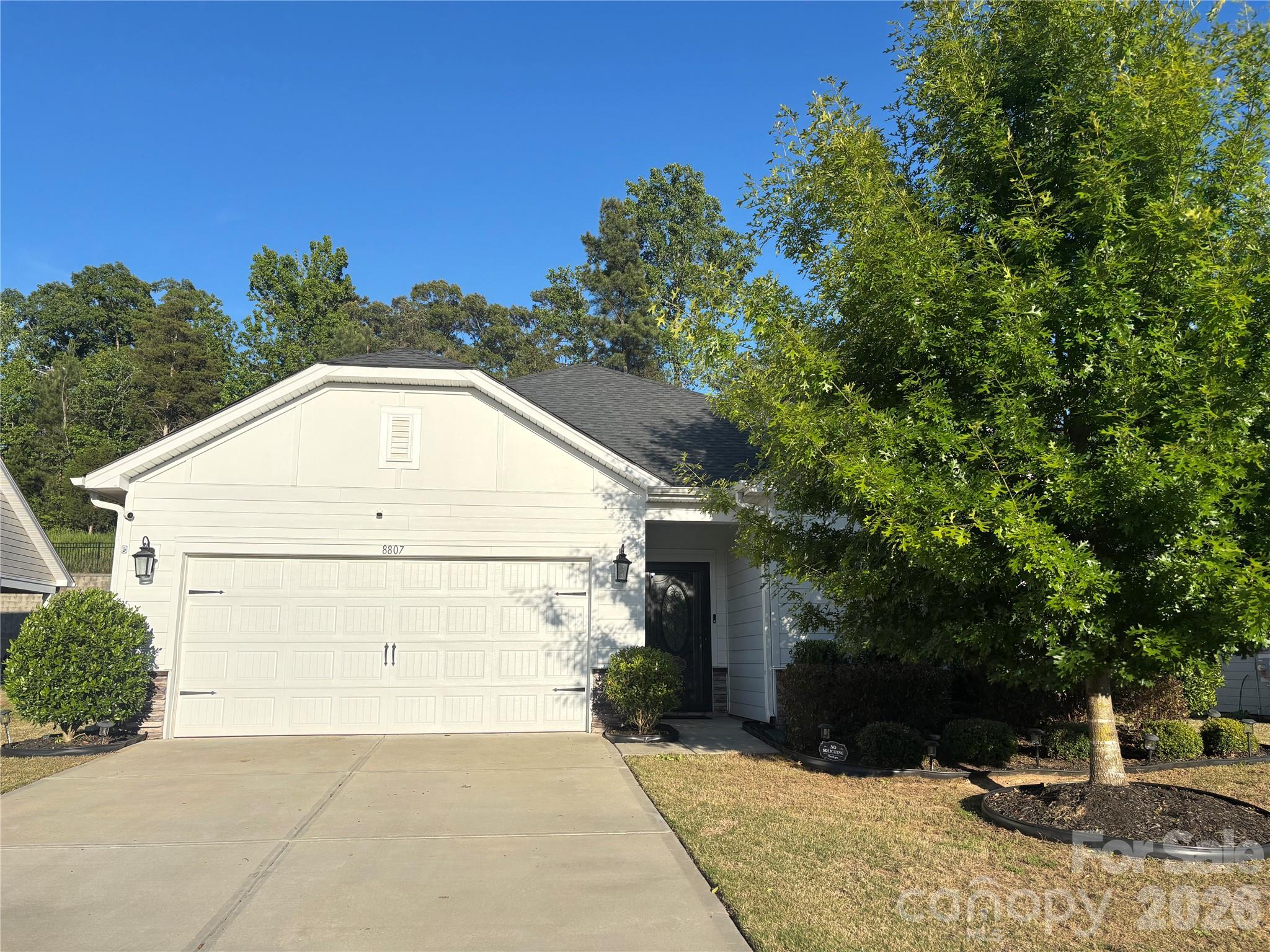 Welcome to this beautifully upgraded 3-bedroom, 2-bath ranch home featuring a versatile flex room that can serve as a home office, media room, hobby space, fitness room, or potential fourth bedroom.

This move-in-ready home offers an open and inviting floor plan with 9-foot ceilings, elegant crown molding throughout, luxury vinyl plank flooring in the main living areas, carpeted bedrooms, and tile flooring in the bathrooms. Thoughtful upgrades can be found throughout the home, including upgraded lighting fixtures, ceiling fans in every room, upgraded interior doors, custom wood-trimmed windows, decorative glass pantry and laundry room doors, upgraded bathroom mirrors, and a stunning designer accent wall that creates a beautiful focal point in the living area.

The spacious kitchen is designed for both everyday living and entertaining and features a double oven, built-in microwave, ample cabinetry, and generous countertop space.

The primary and secondary bathrooms feature double-sink vanities, upgraded mirrors, and decorative tile backsplashes, adding style and a custom touch.

Step outside and enjoy the covered patio complete with a mounted TV, perfect for relaxing evenings or entertaining guests. The spacious backyard offers ample room for outdoor recreation, gardening, entertaining, or other activities and is partially fenced on two sides.

Residents enjoy access to recently renovated neighborhood amenities, including a clubhouse and pool. Conveniently situated approximately 10 minutes from Charlotte Douglas International Airport, 5 minutes from I-485 and I-85, minutes from Lake Wylie, and close to a variety of shopping, dining, and entertainment destinations.

With extensive upgrades rarely found within the community, flexible living space, desirable amenities, and a highly convenient location, this home offers an exceptional combination of comfort, style, and functionality.