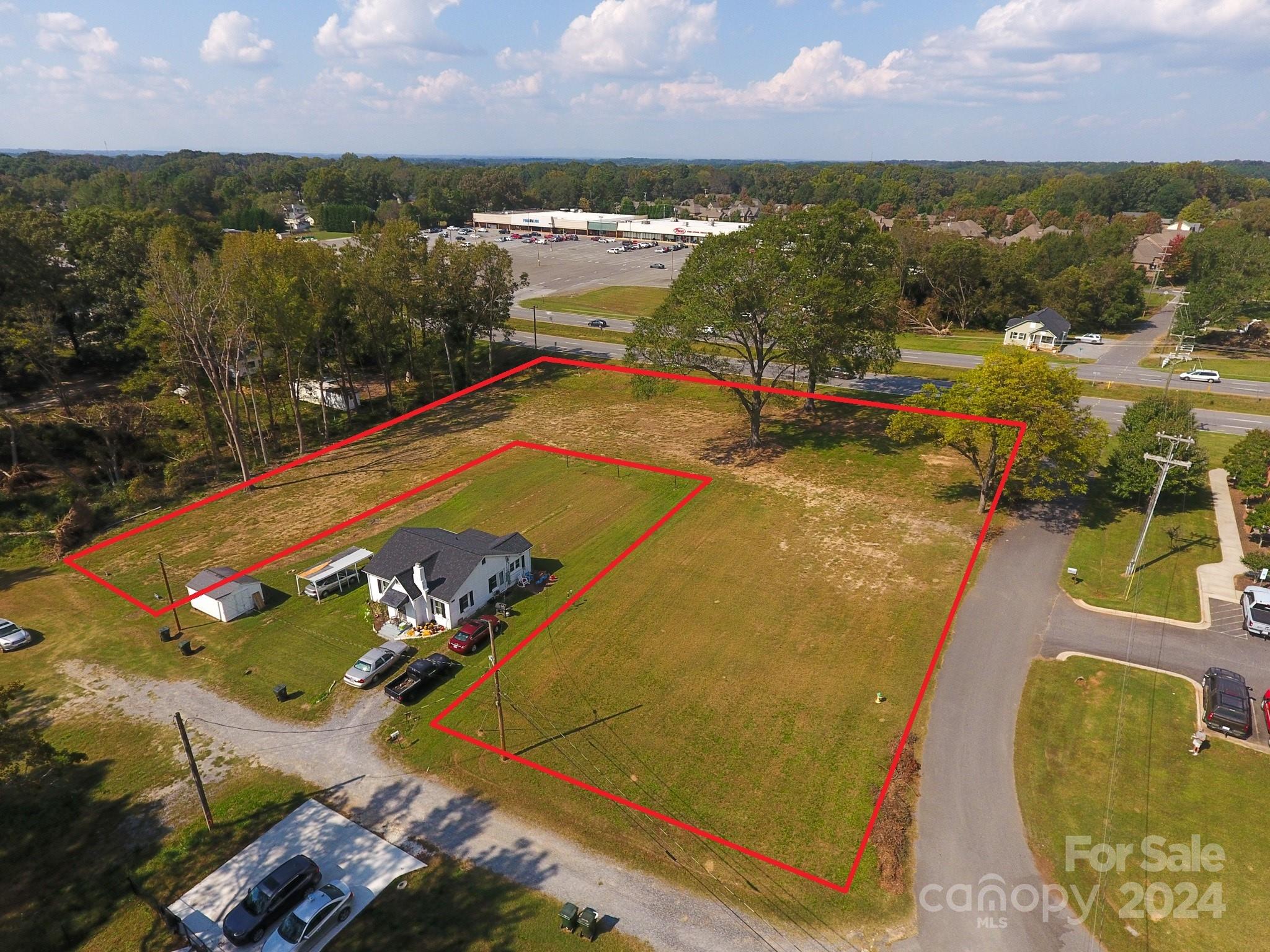 Located at 1301 Shelby Road in Kings Mountain, NC.  This property is currently zoned Surburban Residential (SR). 
 The City of Kings Mountain's Future Land Use Map calls for this property to be Auto-Urban Commercial (AU). 
 NCDOT traffic maps indicate 10500 cars per day as of 2021.  This property has approximately 325 feet of road frontage on Shelby Road (Highway 74 Business).  Location:  beside the City of Kings Mountain Fire Station # 2 and across Shelby Road from the Food Lion / Roses shopping center and approximately 1/3 of a mile west of the Walmart Market, McDonalds, CVS, Pizza Hut, and other restaurants and retailers.