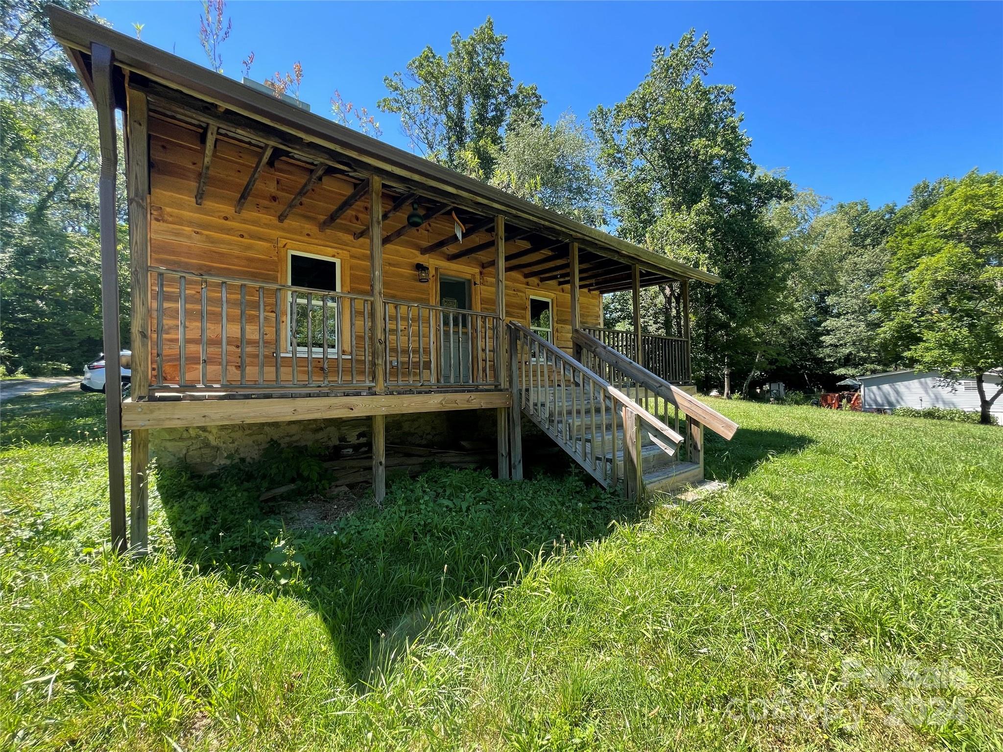 Country living awaits your vision with endless possibilities! Finish the one-bedroom, one-bath cabin built in 1924, featuring a wood-burning fireplace, new electrical, plumbing, roof, windows, tankless water heater, and floors. Live in the 200-square-foot tint home! The cabin and tiny home are on the same well and septic; however, there are separate electrical meters and propane tanks for #22 & #38 Lloyd Barnwell. There is room on the 1.68 acres for future garden beds or animals to roam with no restrictions other than R3 county zoning. There is a road maintenance agreement and right of way.