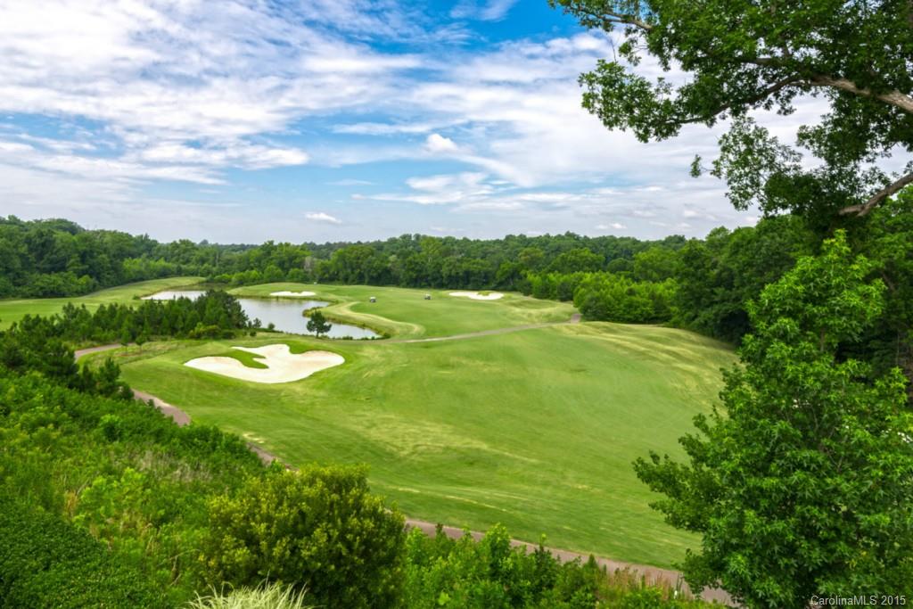 4 Bedroom/3.5 Bath Cumberland Hall w. Finished Basement. Nestled Atop One of the Highest Points in Sun City, this Incredible Home Offers Panoramic Views of the 13th Green & Fairway, 14th Fairway, Lake, & The Catawba River! Absolutely One of the Best Views in the Community! Oversized Screened Porch & Deck with Retractable Awning Overlook Spectacular Views. Enjoy Endless Features such as a Gourmet Kitchen with Breakfast Nook, Office, Diagonal Walnut Flooring, Crown Molding, & more!