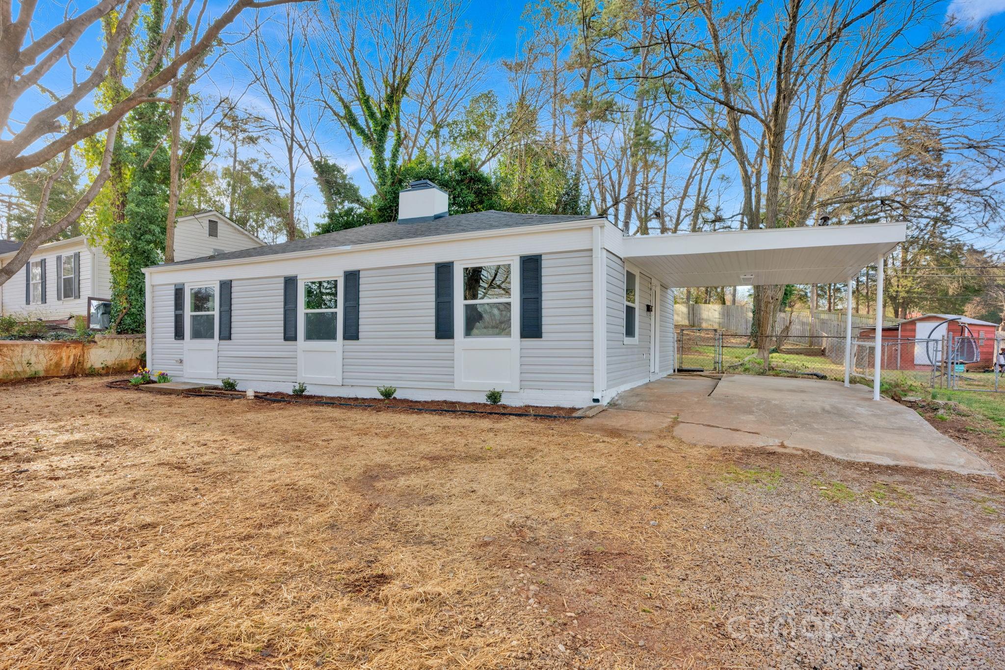The American Dream is still attainable! This is a beautifully renovated and affordable 3 bed, 1 bath home with a carport and partially fenced backyard with not one, but two sheds included! The larger shed has a brand new deck built off of it as well! This home has a brand new roof, new HVAC, new kitchen counters and appliances, (Fridge not pictured but will be included with sale!) new flooring, paint, new bathroom tub and vanity, new sewer line from home to street, and more! This is a perfect opportunity for those who may be looking to purchase their first home or those who may be looking to downsize. This home is in a very quiet and central location to all things in Rock Hill. It is walking distance to Richmond Drive Elementary school and minutes away from several Rock Hill Parks. Seller willing to offer closing credit with acceptable offer! Take action today and schedule a showing for this property to make it yours!