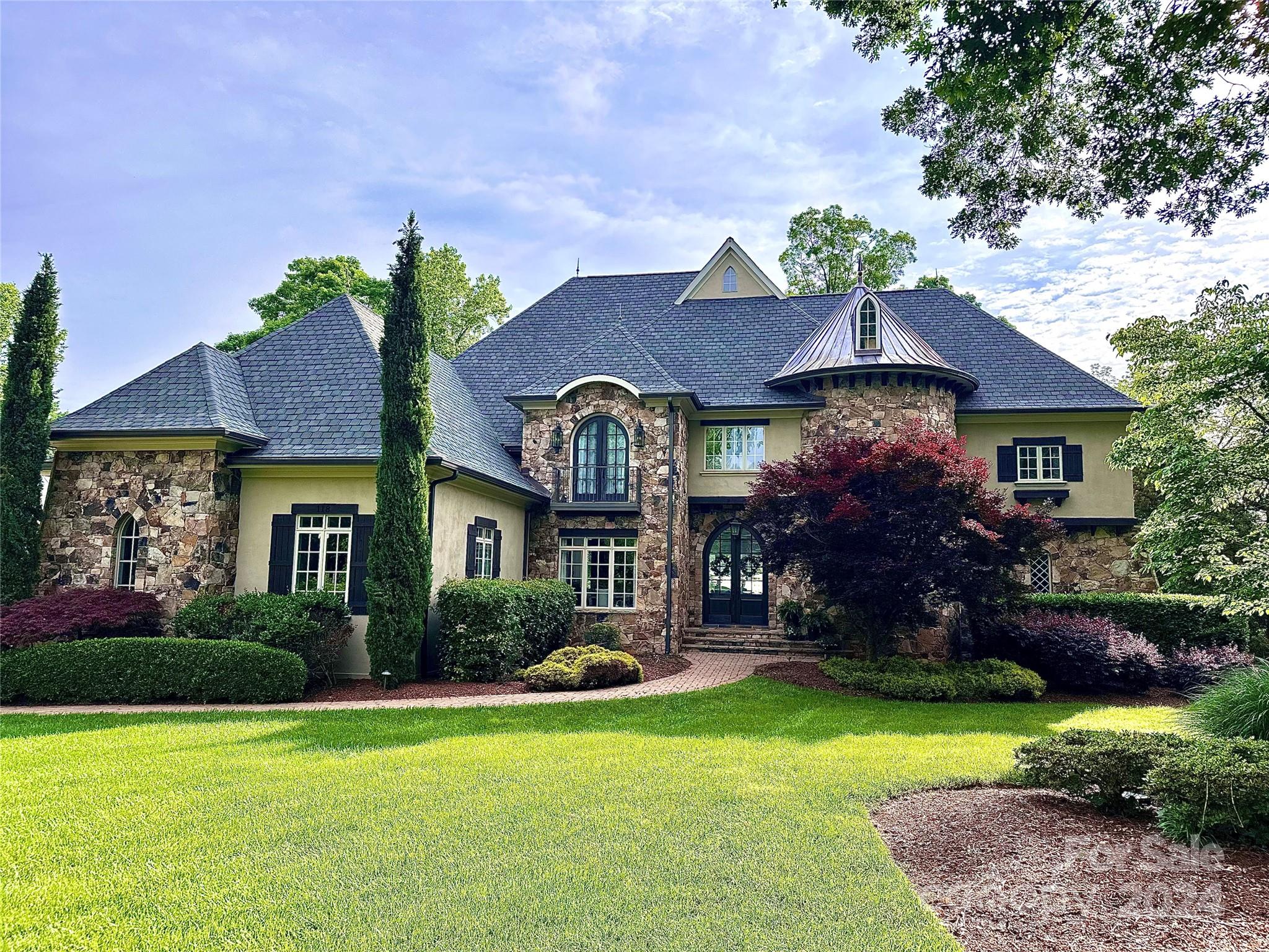 Spectacular Lake Norman Estate with over 140' of shoreline boasting an amazing stucco/stone exterior and well equipped interior with stunning features throughout. Prepare meals in the gourmet kitchen that opens to an octagonal shaped keeping area with expansive lake views. Master suite on the main with separate study/office. The upper level boasts 3 spacious bedrooms each with its own full bath, an enormous bonus room and additional 4th bedroom/flex bonus room. The walkout basement includes this homes full second kitchen, game room, theater room, full bath and 5th bedroom with lake views. This fenced in backyard has it all!Sit around your fire pit or enjoy your newly renovated salt water pool with hot tub along with a paddle board launch area, outdoor TV and bar/beverage station. This home is equipped with the prestigious Savant home audio inside and out, so you can entertain with ease. Located in the desirable The Point community and close to club and neighborhood amenities.