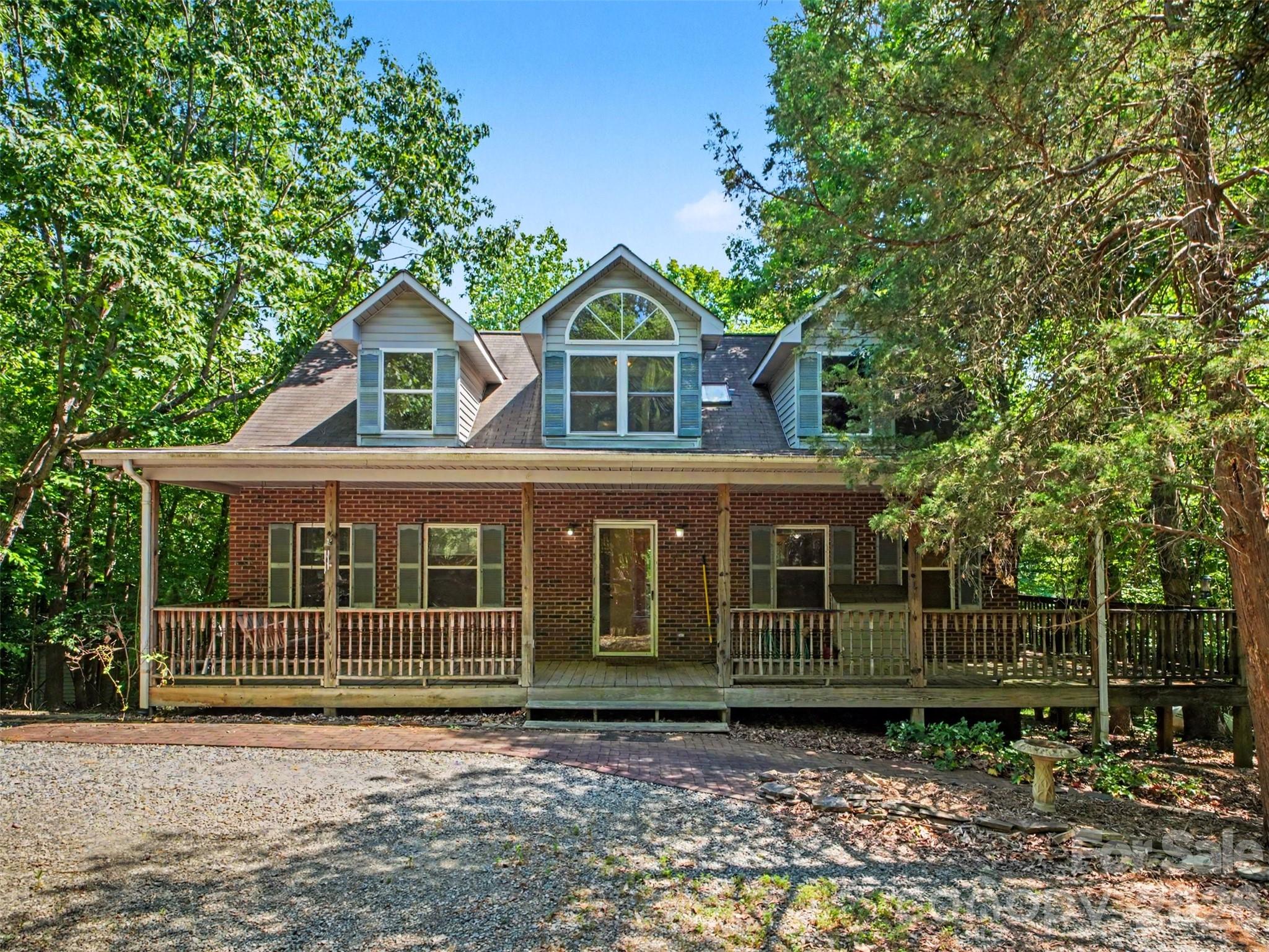 Set on 5.01 wooded acres in Huntersville, this all-brick home offers a setting that's hard to find. The long driveway, mature trees, and peaceful surroundings create a sense of privacy while still being just minutes from shopping, dining, schools, and major highways.

With 3 bedrooms, 2.5 bathrooms, right under 2,000 sq ft, the home has plenty of room to make it your own. The unfinished basement offers additional space for storage, a workshop, or future expansion. An oversized attached garage and a large detached two-car garage provide plenty of room for vehicles, tools, equipment, and hobbies.

One of the best features is the deck overlooking the woods. It's an easy place to spend time—whether that's enjoying your morning coffee, watching the wildlife, hosting friends and family, or simply relaxing and enjoying the quiet.

Properties like this are becoming increasingly hard to find in Huntersville. If you've been looking for land, privacy, and a home with plenty of potential, this property is worth a closer look.