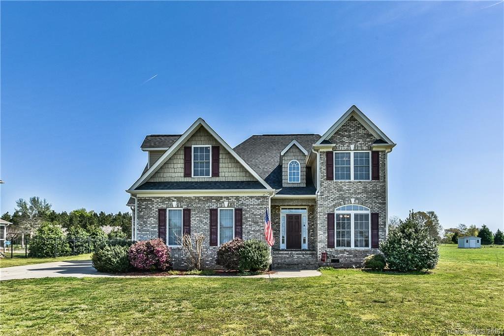 Gorgeous 3 bedroom/2.5 bath home on 1 acre, level lot! Hardwood floors, crown molding, freshly painted throughout. Wainscoting in DR. Spacious kitchen w/granite countertops, stainless steel appliances, dbl sink, two  pantries! Two story family room w/gas fireplace. Private, main level, master suite w/multi step tray ceiling, crown moulding, sitting area w/valued ceiling! WIC located off of spacious master bath w/double sinks, shower & jetted tub. Addt'l bedrooms, bonus room & office upstairs!