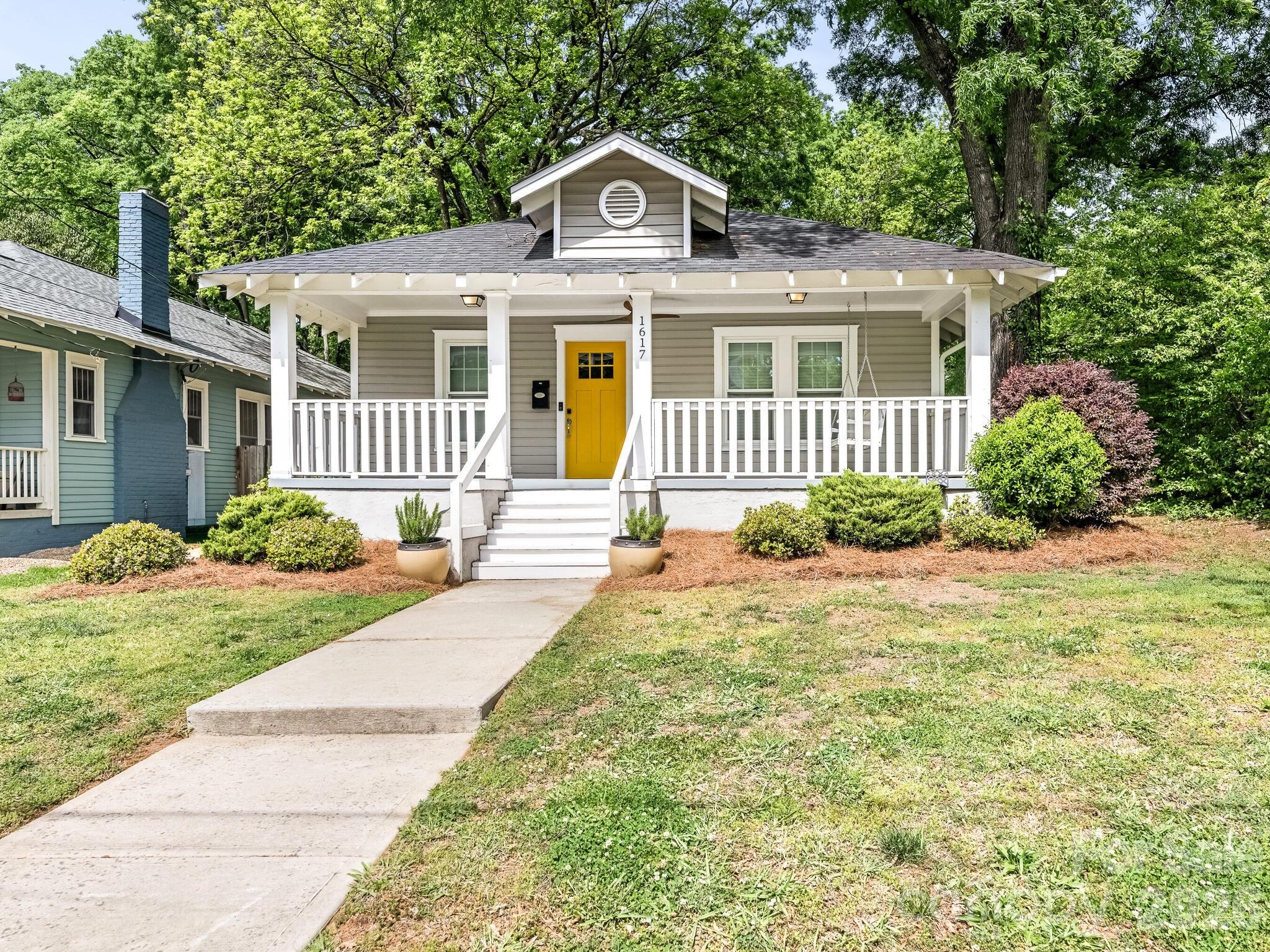 Welcome to this beautifully updated bungalow in the highly sought-after Belmont neighborhood. A spacious, covered front porch sets a warm and inviting tone as you enter the home.

Inside, you’ll find an open-concept layout with generous space for living, dining, and entertaining. The updated kitchen is a standout feature, complete with a premium Thermador range, crisp white cabinetry, classic stone countertops, a large eat-in island, and stylish faux copper backsplash and stainless steel appliances.

The primary suite offers a relaxing retreat with a large walk-in closet and a spa-inspired bathroom featuring dual vanities, an oversized shower, and elegant updated tilework. Secondary bedrooms are generously sized and include ample closet space.

Adding even more versatility, two detached bonus rooms provide endless possibilities - perfect for a home office, gym, studio, or additional storage.

This home combines charm, functionality, and modern updates in one of the area’s most desirable locations.