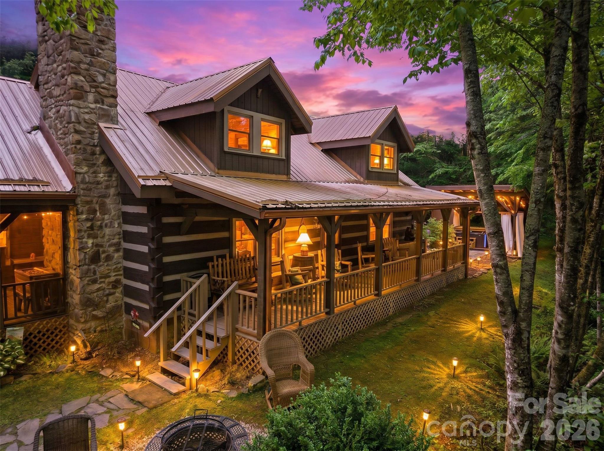 Nestled on nearly five acres in the heart of the High Country, this updated log cabin retreat offers the perfect blend of rustic charm and modern comfort. Featuring 5 spacious bedrooms (you do have to walk thru one bedroom to access the second on the upper level), a floor to ceiling stone fireplace, and inviting spaces designed for gathering, this property captures the essence of mountain living. Enjoy peaceful water views, room to roam and the privacy of a picturesque setting, all while being just minutes from downtown Boone, local dining, shopping and Appalachian State University. Whether you're searching for a primary residence, mountain getaway, or investment opportunity, this unique property delivers the space, character and location that make the High Country so desirable. This property offers a great rental history generating approximately $80,000 annually with repeat visitors! There is not a recent survey, and buyers are encouraged to have to property surveyed during their due diligence period. Area along the creek does lie within a floodplain but house does not. (THIS PROPERTY IS FULLY RENTED FOR JUNE & JULY.  SELLERS HAVE INDICATED THAT HOME CAN BE SHOWN ON TURN AROUND DAYS SO PLEASE CONTACT LISTING AGENT REGARDING AVAILABILITY)
