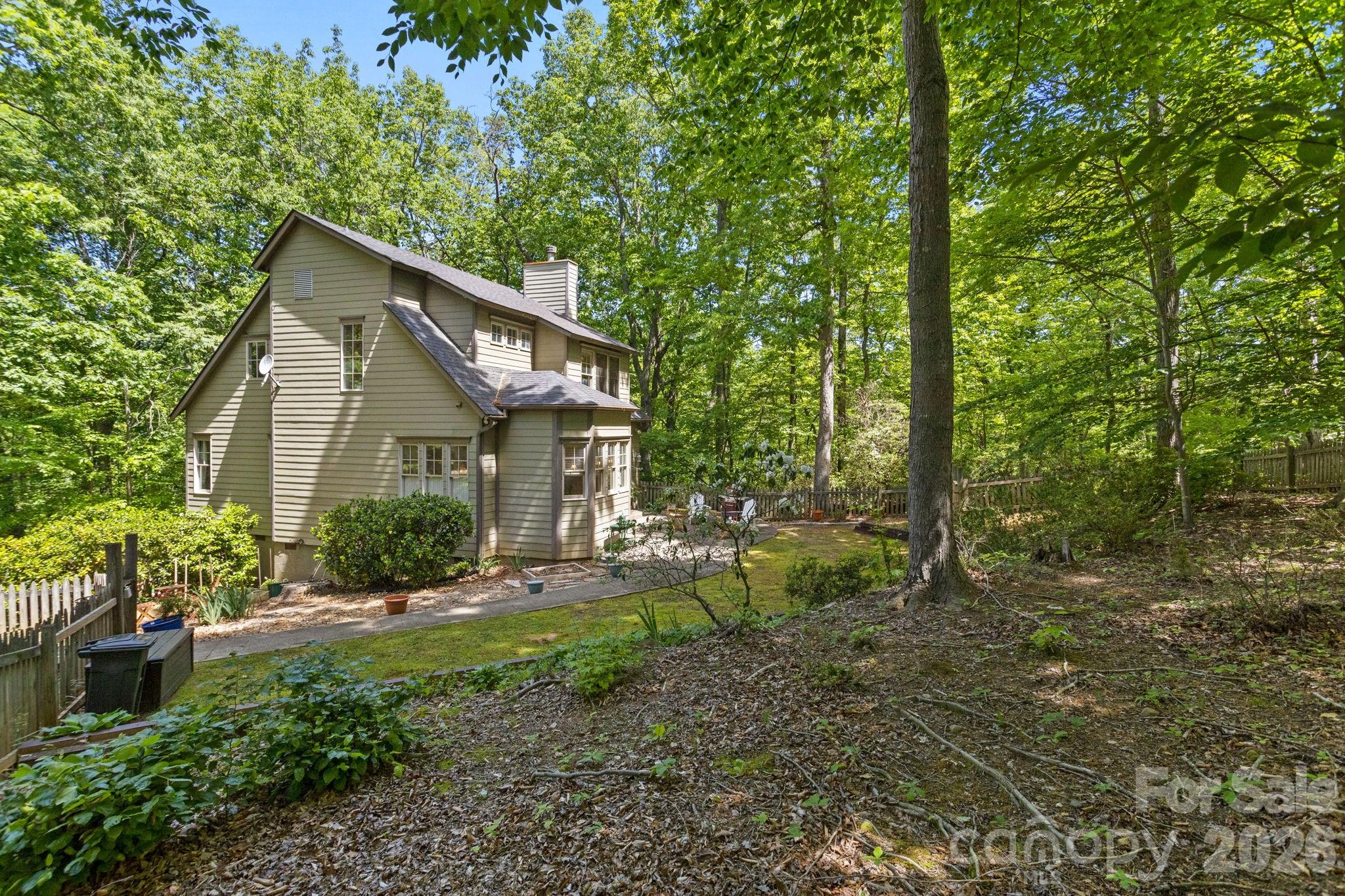 Lovely 3 BR, 3B home located in the heart of Hunting Country. As you enter, you will be struck by the high ceilings and the large windows, which enhance the bright and airy feeling of this elegant retreat. The living room features hardwood flooring, a 9 ft Tennessee field stone fireplace and custom built- in bookcases. The well appointed kitchen is a chef’s delight, featuring extensive custom cabinetry and plenty of counter space. Upstairs you will find the sunshine filled spacious master suite with adjoining two person shower and oversize soaking tub. Enjoy nature in the private setting surrounding the property, while relaxing on the screened in porch. Lovely patio and garden for dining al fresco. Situated on 2.9 acres. All very well maintained. This home offers the perfect blend of elegance and casual living in a natural setting. Within 15 minutes of Tryon, Landrum and Columbus.