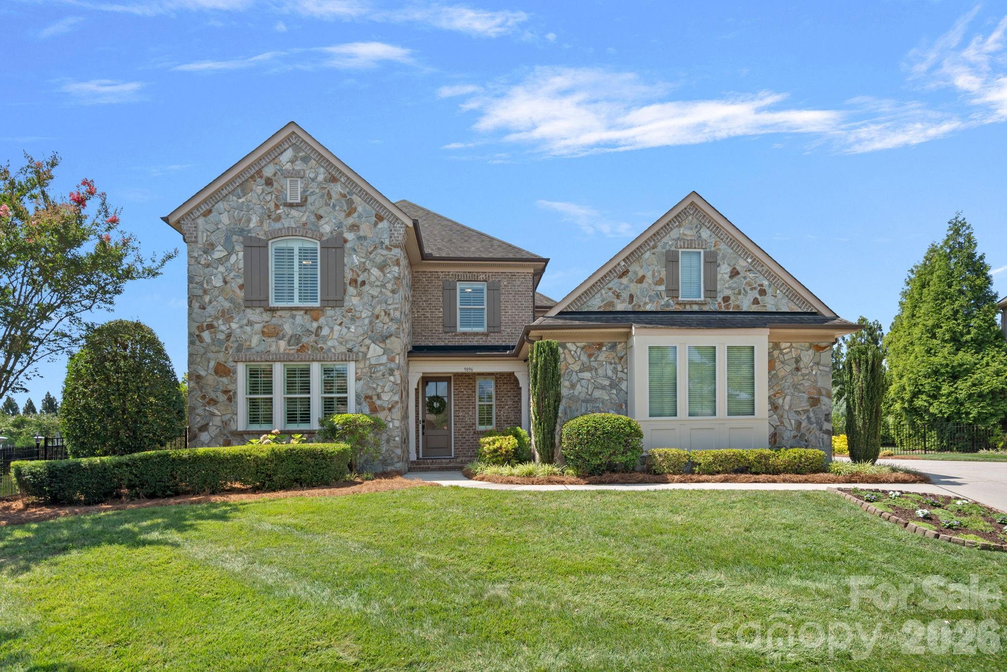 Beautifully maintained Classica home offering elevated upgrades, quality finishes, and exceptional indoor-outdoor living. Located in the highly sought-after Christenbury Glen community and award-winning Cox Mill school district. The main level features 10-inch wide luxury CALI LVP throughout, complemented by new carpet in the office and primary bedroom. At the heart of the home, the kitchen showcases a large island, Sea Pearl Quartzite countertops, Café appliances, and a butler’s pantry. Cellular shades and plantation shutters are featured throughout, offering both style and everyday function.

The main-level primary suite features a beautifully updated en-suite with luxury tile, marble countertops and a remodeled shower with dual shower heads, each with personalized temperature controls. The spacious walk-in closet is complete with a custom Elfa closet system, providing endless storage opportunities. Upstairs there are four bedrooms, three bathrooms and a large bonus room that provides a generous space for guests, entertaining, or everyday living. 

Outside, the private fenced backyard is designed for relaxation and entertaining with two covered patios, outdoor TVs, and a resort-style pool area. Enjoy your outdoor retreat year-round with a heated saltwater pool featuring a built-in hot tub, tanning ledge, built-in underwater bench seating, waterfall features, and wireless controls. The two-car portion of the three-car garage is heated and cooled, offering added flexibility for a home gym, workshop or storage.