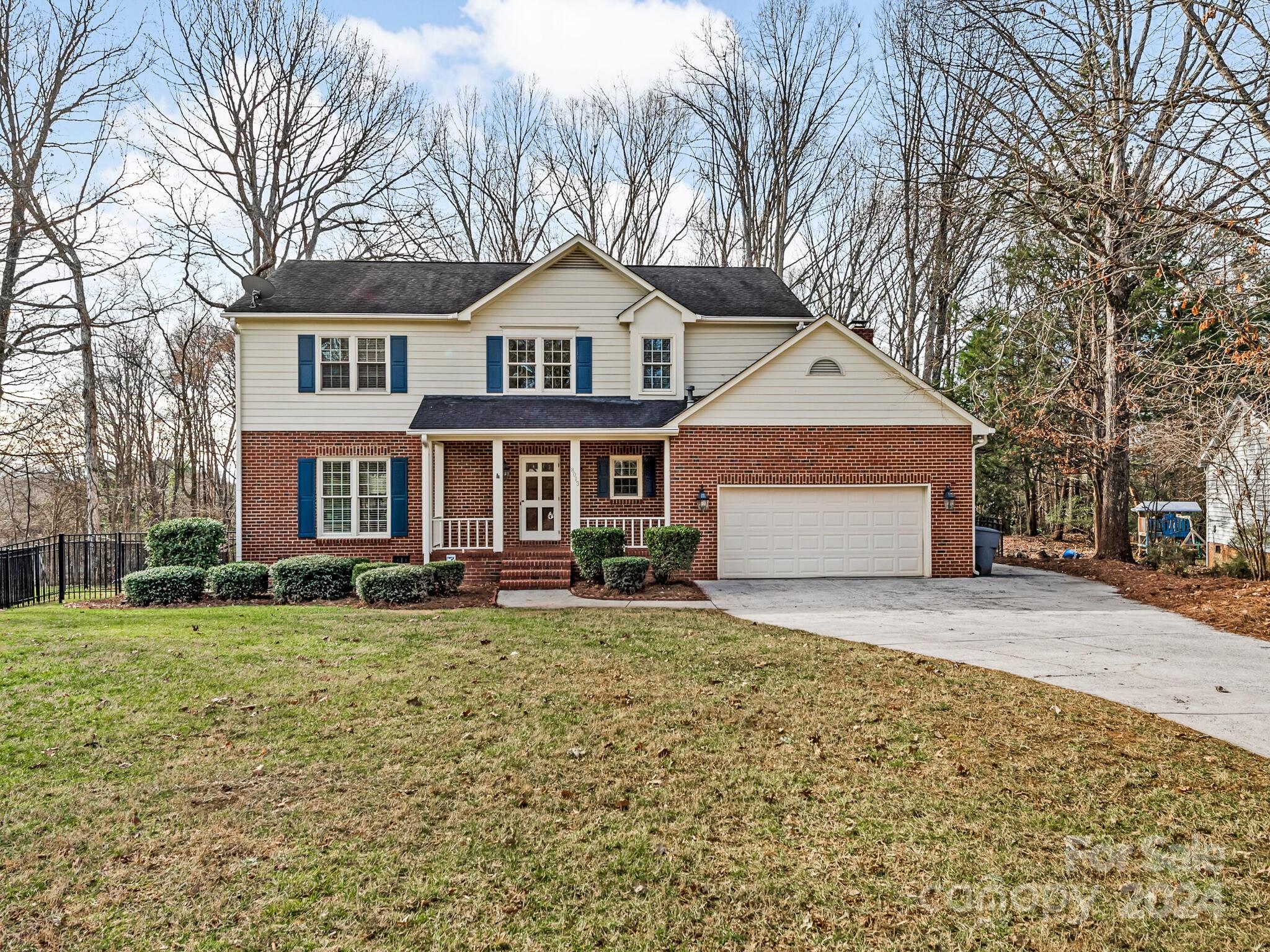 Welcome to this bright and sunny home with views of the Raintree golf course! This 4 bedroom 2.5 bathroom home has something for everyone. This open floorplan has multiple living spaces downstairs great for entertaining or just being home. Both floors have brand new carpet. Kitchen has tons of cabinetry with great storage, an island, granite countertops and is open to the cozy den with brick mantle and gas logs fireplace. The 3 season porch off this area will live up to its name and be used all year round. A convenient main floor laundry room and attached garage are also highlights of the main floor. Upstairs you will find 4 nice sized bedrooms including the primary suite with a large walk in closet. There is also walk in attic storage on this floor. The house sits in a cul de sac in a convenient location just minutes away from the Arboretum, shopping, and restaurants.