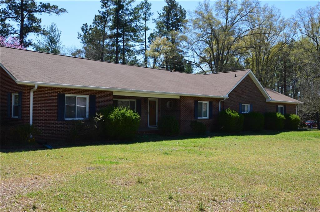 Great Opportunity and location - Just a few minutes from I-77.  All brick ranch home on 1.5 acres.  Hardwood floors throughout main.  Large garage with brick pavers leading to a large workshop ~ glassed in for multi-purpose use.  Great for the car enthusiast.  New cooktop, counters & backsplash have been installed in kitchen.  Lots of possibilities with this home. Upstairs contains a bonus living area includes a bedroom, bonus room & flex/exercise room.