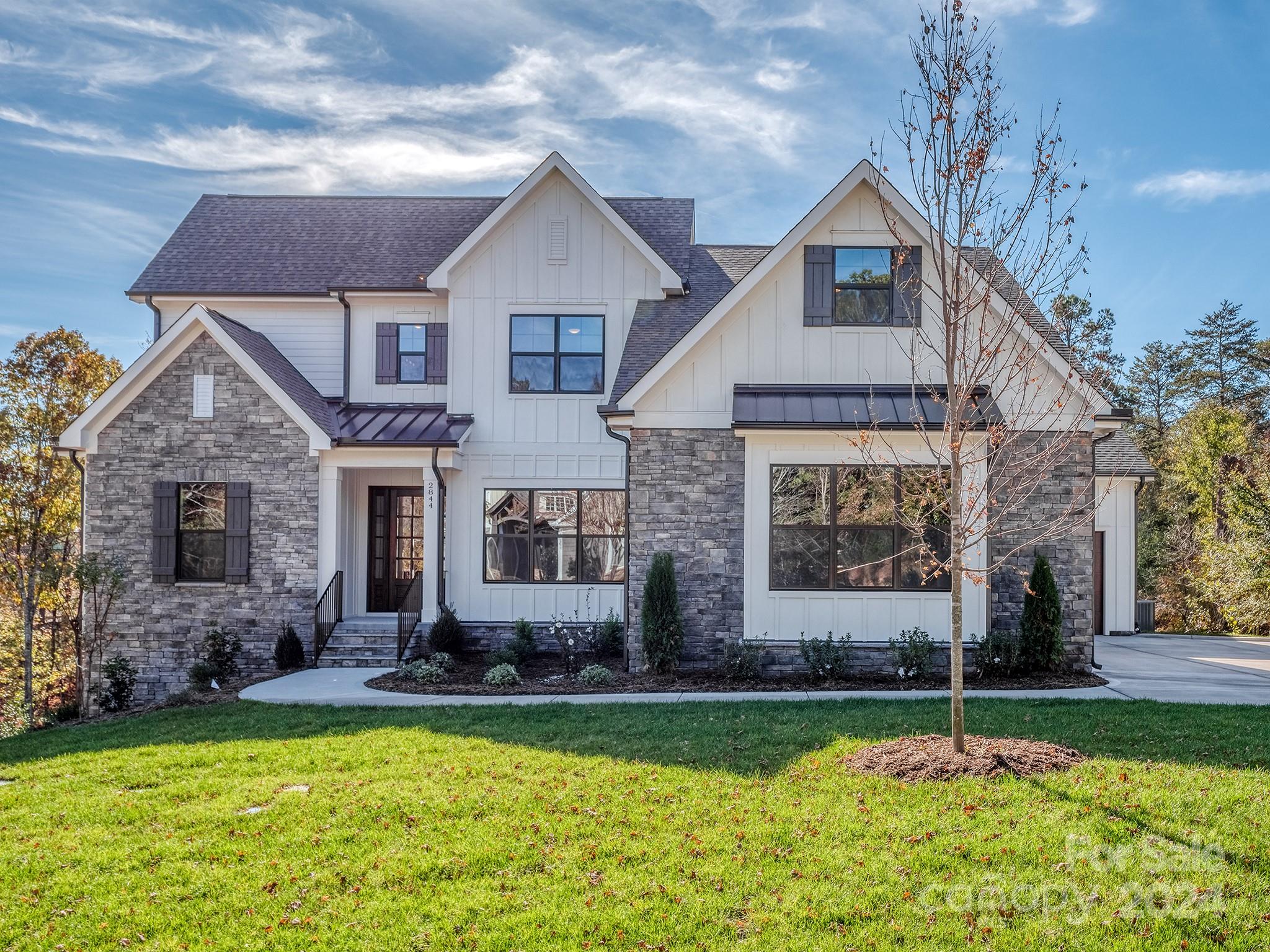 This beautiful new home is constructed on one of the few remaining custom lots in the established lake front community, Handsmill on Lake Wylie. The home features 6 bedrooms, 6 baths, spectacular kitchen open to dining and great room w/fireplace, a keeping room, large bonus room, mud room, a large covered deck with a fireplace and views of hardwoods and a creek leading to Lake Wylie.  The basement level is perfect for very comfortable multi-generational living, featuring a full in-law suite, secondary bedroom with full bath, kitchen, dining, laundry, workout or media room, and a large living room.  Handsmill is one of Lake Wylie's premier custom home communities, featuring a quiet atmosphere to take in nature, a community pool with clubhouse, walking trails and just minutes from top rated Clover schools, restaurants, and shopping.  Home is complete and ready to move in before Thanksgiving!
