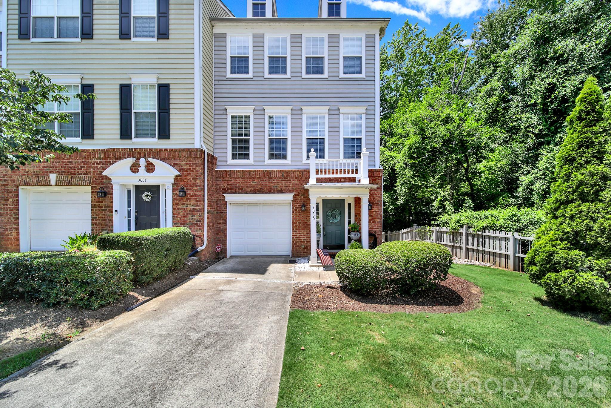 Charming end-unit townhome in the highly desirable Magnolia Park community, perfectly positioned against a private wooded backdrop for added privacy and peaceful views. Enjoy an exceptional South Charlotte location just minutes from SouthPark Mall, Park Road Shopping Center, Uptown, I-77, and the Little Sugar Creek Greenway.
This move-in-ready home offers a welcoming foyer, a versatile first-floor bedroom or flex space with built-in shelving (no closet), a conveniently located laundry room, and access to the attached garage. The spacious main living level features an expansive kitchen, an inviting family room with a gas fireplace, and a large private deck overlooking the woods—perfect for relaxing or entertaining with no neighbors behind.

Upstairs, dual primary suites each feature walk-in closets and private en-suite baths, providing exceptional comfort and flexibility for guests, roommates, or a home office.

Thoughtfully maintained and updated, this home includes a new dishwasher (2026), recently power washed exterior, updated landscaping and retaining wall (2026), a newly installed French drain, updated window blinds (2021), and a built-in JBL surround sound system in the living room. Combining low-maintenance living, modern updates, a premium end-unit location, and an unbeatable South Charlotte address, this home truly offers the best of SouthPark-area living.