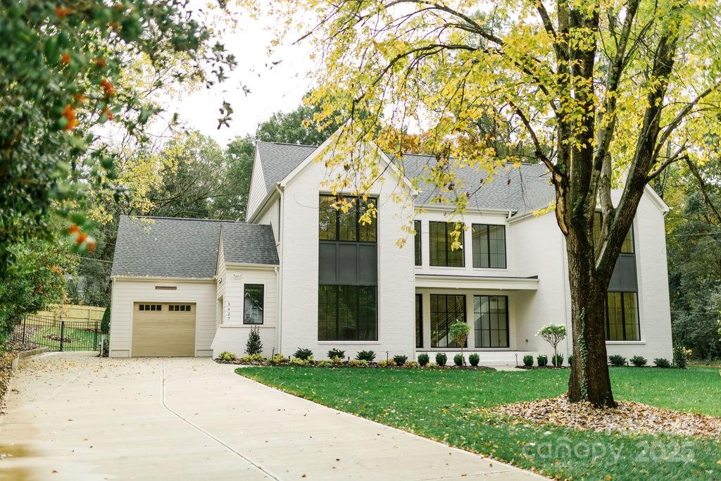 This stunning modern-contemporary retreat sits on .42 acres & blends sleek design w/ everyday comfort. Expansive windows flood the two-story foyer w/ natural light, setting the stage for the striking floating staircase and open, airy floor plan. This 5 bed home is designed for convenience & luxury, The 1st-floor features the primary suite w/ vaulted ceiling, spa-inspired en-suite & huge walk-in closet w/ a stacked w/d option along w/ guest suite & full bath to ensure comfort for visitors. The kitchen is complete w/ a dedicated scullery w/ ice maker & 2nd dishwasher, a separate pantry w/ added countertop space and abundant storage. Upstairs, you’ll find 3 additional bedroom suites, each with spacious walk-in closets and en-suite baths. A versatile rec room w/ a wet bar & Bev fridge, a walk-in laundry room & added storage for function & future use. From its bold architectural details to its thoughtful design touches, this modern sanctuary won't last long. Pool Option Available.