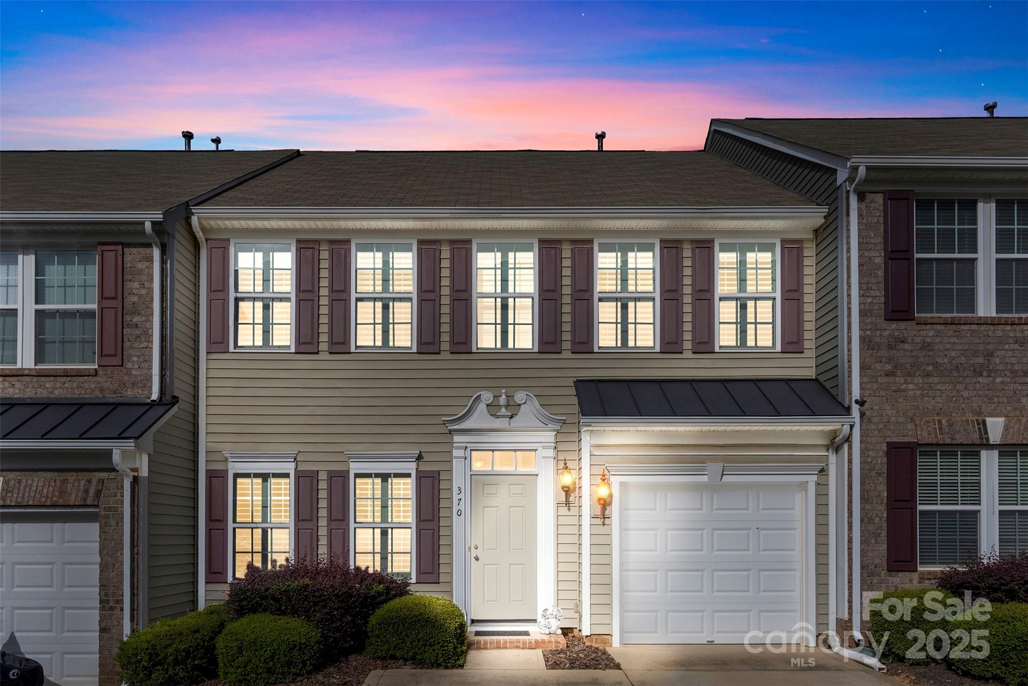 Welcome to Harper's Green, a wonderful gated townhome community. Located in Clover and minutes from Lake Wylie shopping, dining and entertainment. This townhome has lots of upgrades and has been tastefully updated throughout. The main level is spacious and well designed with a functional layout. In the kitchen you will find gorgeous cabinetry and granite countertops with neutral tones, a pantry and bar overlooking the living area. All appliances convey including the refrigerator. Your living area is located on the back of the home and has a gas fireplace giving you a peaceful setting overlooking your private backyard. The sunroom offers another great option to relax and unwind after a long day. All 3  bedrooms are located on the upper level. The primary bath has been updated with a beautiful walk-in tiled shower, new cabinets and counter tops and also includes a walk-in closet with custom shelving. The primary bedroom also has an additional walk-in closet for added storage. The laundry room is located in the hall on the upper level. The seller has went through great measures to update the home giving it a more custom feel. All windows include custom plantation shutters. The downstairs flooring was updated to hardwoods throughout. Most of the home has crown molding for added details. Enjoy this maintenance free living and have a peace of mind with 24 hr gated access. Access to award winning schools and low SC taxes is another great reason to make this house your home!