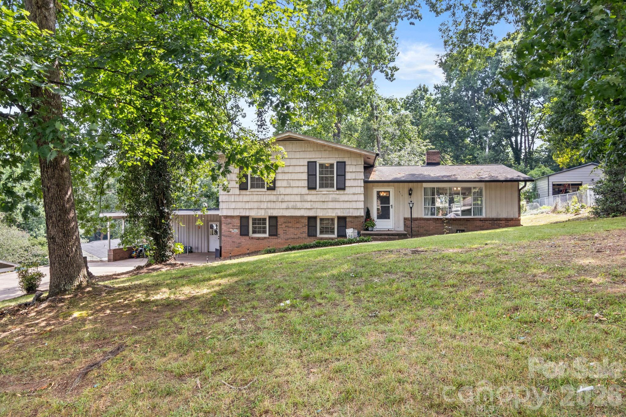 Back on the market and now offered at an incredible new price! Welcome home to this wonderful 4-bedroom, 2-bath residence located in one of Shelby’s most desirable areas—just moments from the country club and only minutes from shopping, dining, and entertainment. The main level features a bright and inviting living room and dining area with beautiful hardwood floors and a charming bay window, creating a warm and welcoming atmosphere. The well-appointed kitchen offers newer appliances, updated hardware, and plenty of functionality for everyday living. Upstairs, you’ll find three comfortable bedrooms and a beautifully renovated full bathroom. The lower level is currently being utilized as a spacious primary suite complete with a separate office and a fully renovated bathroom featuring a walk-in shower. This flexible space could also serve as a second family room with an office, guest room, or additional living area to suit your needs. Step outside to enjoy the generous patio overlooking the nicely sized backyard—perfect for entertaining, relaxing, or spending time with family and friends. A poured concrete pad provides an ideal location for a fire pit and outdoor gatherings and is large enough to accommodate a 24-foot above-ground pool. Additional storage is plentiful with a large 331-square-foot storage area conveniently located off the carport.

Recent updates include:

• Fresh paint (lower level)

• Flat ceiling (second full bathroom) 

• All exterior doors

• Gutters and leaf guards

• Flat ceilings in main living spaces

• Kitchen appliances & hardware (refrigerator, range, dishwasher)

• Renovated bathrooms

• Interior light fixtures

• Exterior security cameras

• Concrete pad

• The water heaters heating elements & thermostat replaced in 2025. 

• HVAC serviced May 2025

Don’t miss your opportunity to make this beautiful home yours!