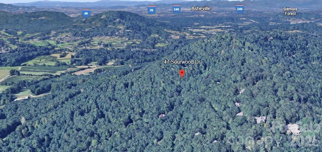 Build your dream home on Lot 197 at 47 Sourwood Dr in the gated High Vista community! This wooded lot offers gentle topography, mature trees, and a peaceful setting—plus a 3-bedroom septic system already in place, saving time and money. Enjoy privacy and convenience just minutes from Asheville, Hendersonville, and the Asheville Airport. High Vista offers a voluntary POA with minimal dues and optional membership for access to a private golf course, clubhouse, pool, tennis, dining, and events. Located between South Asheville and Mills River, the neighborhood is well-established and close to shopping, dining, and breweries. UNDER $50,000 and near tax value, this lot is a rare find in a desirable WNC location. Bring your builder and vision—come see the value and potential! Call or Text Today for more information.