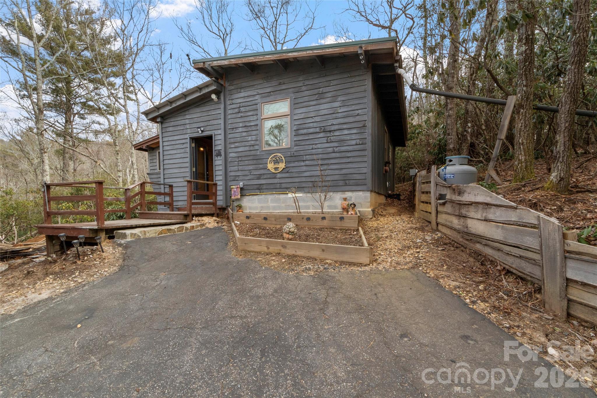 Great investment opportunity located 1 mile off the Blue Ridge Parkway, just beyond Spacious Skies Bear Den Campground. This 1 bedroom, 1 bath cabin is well on its way to completion and ready for your finishing touches. Create the perfect cozy getaway, income-producing short-term rental, or peaceful off-grid retreat. The property backs up to over 200 acres of protected conservation land, offering abundant privacy.
Owners enjoy campground amenities including a swimming/fishing pond, playground, recreational room with pool tables, general store, scenic hiking trails, waterfall, and exceptional stargazing! Spend your evenings gathered around the fire pit making s’mores under the stars. Ideally located just minutes from the Blue Ridge Parkway, this cabin offers easy access to breathtaking views, outdoor adventures, and all the beauty the area has to offer. Whether you’re looking for a weekend escape or an investment opportunity, this property delivers the perfect blend of comfort, nature, and potential.