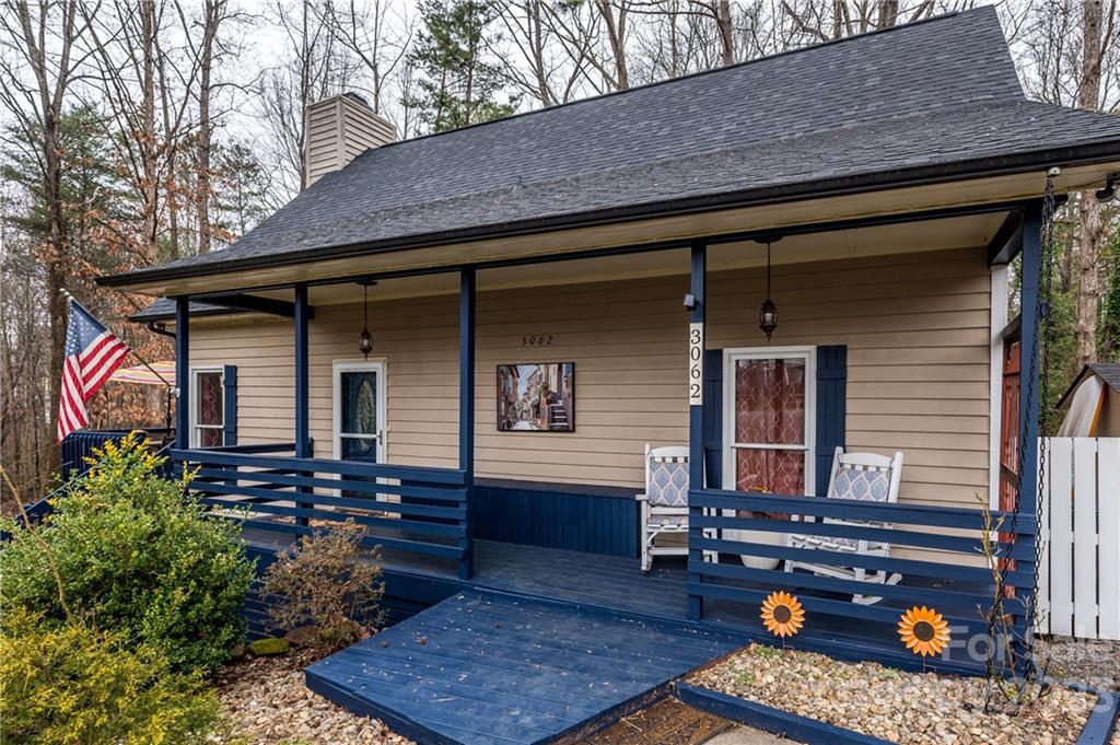 Welcome to resort-style living in Tega Cay! This home has it all, including an inviting rocking chair front porch, 2 cozy attached decks, & 2 large decks w/seasonal views of the water & sunset! 4 spacious BRs & 4 full BTs, 1 ea. on main, 2 ea. upper & 1 ea. lower level. Brazilian cherry wood flooring & luxury vinyl plank on main.  Fantastic, screened porch on lower level w/custom bar that stays, stone wall, scratch & waterproof flooring, is perfect for watching TV & entertaining. Primary bath recently updated; roof new, 2019. Lg deck in yard w/ access from house is a perfect get-away. Fenced yard. Short walk to Pitcarin Park w/boat ramp & swimming docks. Short drive to Tega Cay Marina (public boat ramp; boat club available w/membership) & Windjammer Park w/3 beaches! Miles of walking trails & several city parks. Beach Club w/pool has nominal membership fee; golf course, tennis & pickleball courts are public. Community-organized events thru out the year & sought-after schools close by!