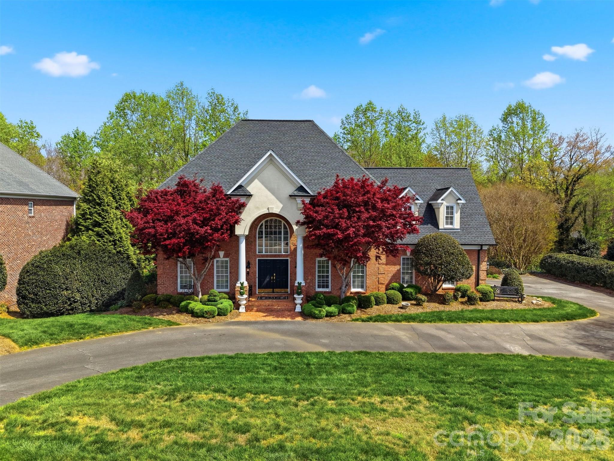 Exquisite all-brick 2.5-story luxury residence with a partially finished basement, located in the prestigious lakefront community of Governor’s Harbor in northwest Hickory. This exceptional home offers refined living with four spacious bedrooms, each featuring a private ensuite bath, thoughtfully designed for both comfort and sophistication.

A grand foyer sets the tone with abundant light and opens to elegant formal living and dining rooms, gleaming hardwood floors, and a beautifully appointed family room with gas log fireplace. The recently renovated gourmet kitchen is a showpiece, featuring newer Kitchenaid appliances, a generous center island, pot filler, and seamless flow into the family room with gas log fireplace—perfect for effortless entertaining. Tastefully curated, custom décor enhances the home’s distinctive character.

The upper level hosts four luxurious ensuite bedrooms, including an impressive primary suite with dual walk-in closets, a spa-inspired bath with soaking tub, private water closet and separate shower. Plush carpeting adds comfort to each bedroom retreat.

A fully finished bonus room with small 'office closet' and full bath are found on the third floor and make for a perfect movie room, workout studio or flex space.

The partially finished lower level is designed for elevated entertaining, offering a sophisticated lounge complete with wet bar, beverage refrigerator, full bath, and private office or additional flex space. Additional unfinished space provides endless possibilities for a workshop, fitness studio, or expanded living area.

Outdoor living is equally impressive with a fully fenced, private backyard, covered patio, and upper-level deck which is ideal for relaxing or hosting gatherings. A main-level garage and circular drive adds convenience.

Residents enjoy lake access and a community dock within this exclusive neighborhood. Ideally located in NW Hickory, Governor’s Harbor is just minutes from shopping, dining, city amenities, private and public schools, and more. Low HOA dues of only $780 per year.

Recent updates include newer roof and HVAC systems. This distinguished home blends timeless elegance, modern comfort, and premier lake community living. Don't miss the opportunity to see this one!