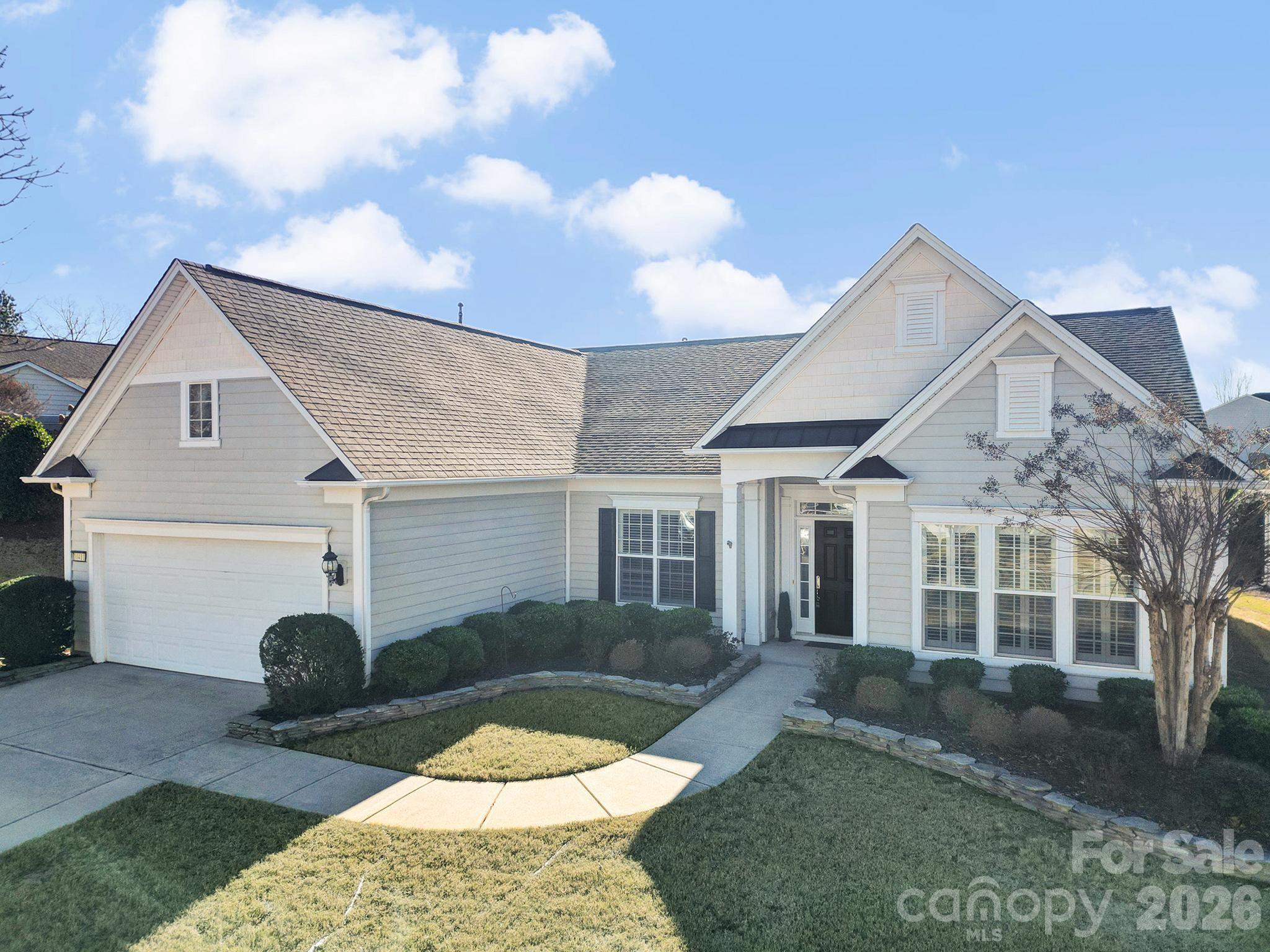 Freshly painted, new carpet, clean and Move-in ready! This lovely Chestnut Garden Ranch home welcomes you from the open formal dining room accented with a tray ceiling, wainscoting, and a chandelier, perfectly positioned just off the foyer. Double doors lead into a private home office, study or hobby room. A spacious great room featuring a gas-log fireplace sits at the back of the home with sweeping views of the backyard. A breakfast nook flows seamlessly from the great room, separated from the kitchen by a convenient breakfast bar. The well-appointed kitchen is a chef’s dream featuring a gas cooktop with hood, built-in microwave and wall oven, a central island, a stylish tile backsplash, and abundant cabinetry for storage. The luxurious primary suite is tucked away for privacy, boasting a tray ceiling and large windows that flood the space with natural light and overlook the backyard. Double doors open to the ensuite bath with dual sink vanity, walk-in shower with glass door and walk-in tub for added luxury and accessibility. Two generous guest bedrooms sit at the front of the home with access to a full hall bath, ideal for overnight guests. Even the laundry room features added luxuries including built-in storage and sink! Enjoy warm days and fresh air on the covered patio with ceiling fans or utilize the extended paver patio. Don’t forget to check out the many resort-style amenities Sun City has to offer including golf club, pools, tennis courts, bocce ball, pickleball, walking trails, social clubs, and more! This is a true 55+ ACTIVE Adult Lifestyle community with over 150 clubs. Conveniently located right next to the Harris Teeter shopping center, with interior community access. You will find plenty of shopping, restaurants, banking and the public Del Webb Library right outside your front door.