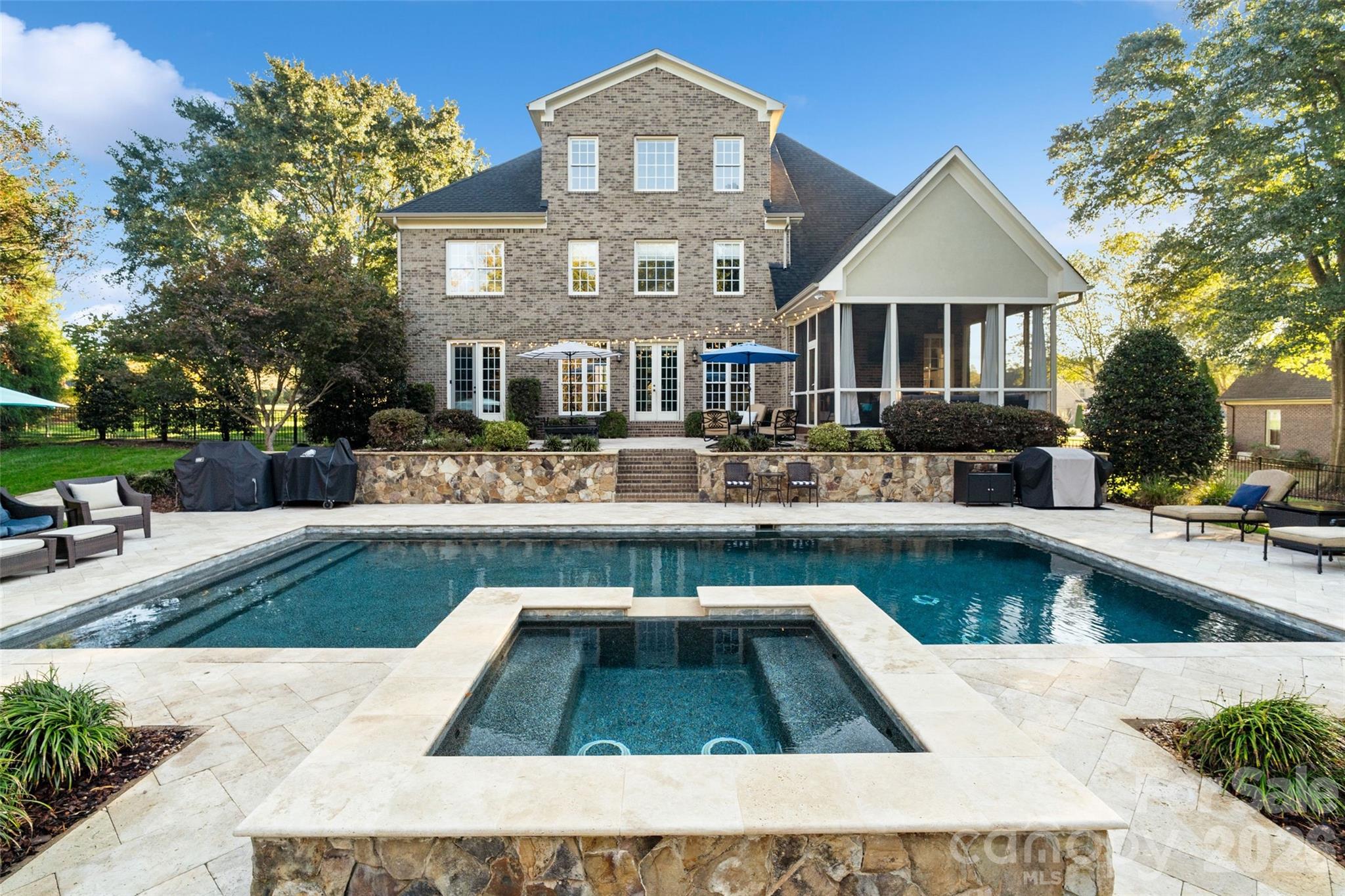 MILLSTONE CREEK COMMUNITY Welcome to 5124 Mill Race Lane, a beautifully maintained home nestled on a quiet 1 acre lot, in a desirable Lancaster community, offering the perfect blend of comfort, style, and everyday luxury.Inside, the home features a bright, open layout ideal for both daily living and entertaining. Spacious living areas flow seamlessly into the kitchen, creating a warm and welcoming atmosphere. The generously sized bedrooms provide comfort and privacy, while the primary suite serves as a quiet retreat filled with natural light and a large sitting area for reading or just relaxing.The attached spa-like primary bathroom features a relaxing garden tub, a separate standing shower, and dual his-and-hers closets. One of the closets conveniently connects to a private laundry room, adding exceptional ease and functionality to this luxurious space Step outside to your private backyard oasis, where an in-ground pool with an attached spa takes center stage. Surrounded by elegant travertine decking, this resort-style space is perfect for entertaining, relaxing, or enjoying sunny Carolina days. Whether hosting gatherings or unwinding in the spa, the outdoor living area offers both beauty and functionality. Set in a peaceful neighborhood yet conveniently located near schools, shopping, dining, and major routes, this home combines tranquility with accessibility.Residents enjoy private access to the neighborhood pond, offering a peaceful escape right at your doorstep. Perfect for fishing, kayaking, paddle boarding, or simply relaxing by the water, this scenic amenity adds an active, outdoor lifestyle element to the community. Whether you’re spending quiet mornings on the water or enjoying family time outdoors, the pond provides year-round enjoyment in a natural setting. The private in-law suite offers comfort and flexibility, featuring its own attached bathroom and direct access to the pool area and a secluded patio. Ideal for guests or multigenerational living, the space provides privacy while staying connected to the home’s resort-style amenities—perfect for relaxing, entertaining, or extended stays. Also, on the main level you'll find a bright and inviting home office, offering the perfect space for productivity or remote work. This versatile room provides a quiet, comfortable setting ideal for a private workspace, study, or flex room. This home also has 2 bonus/flex spaces that can be used for virtually anything you can dream up. The third-floor bonus room features a wet bar and a full bathroom making this space both versatile and convenient, while second floor bonus offers built-in shelving and is perfect for a man cave or home theater. The sizable 3 car garage offers many possibilities for both storage and parking.

This exceptional home offers comfort, style, and outdoor luxury—schedule your private showing today.