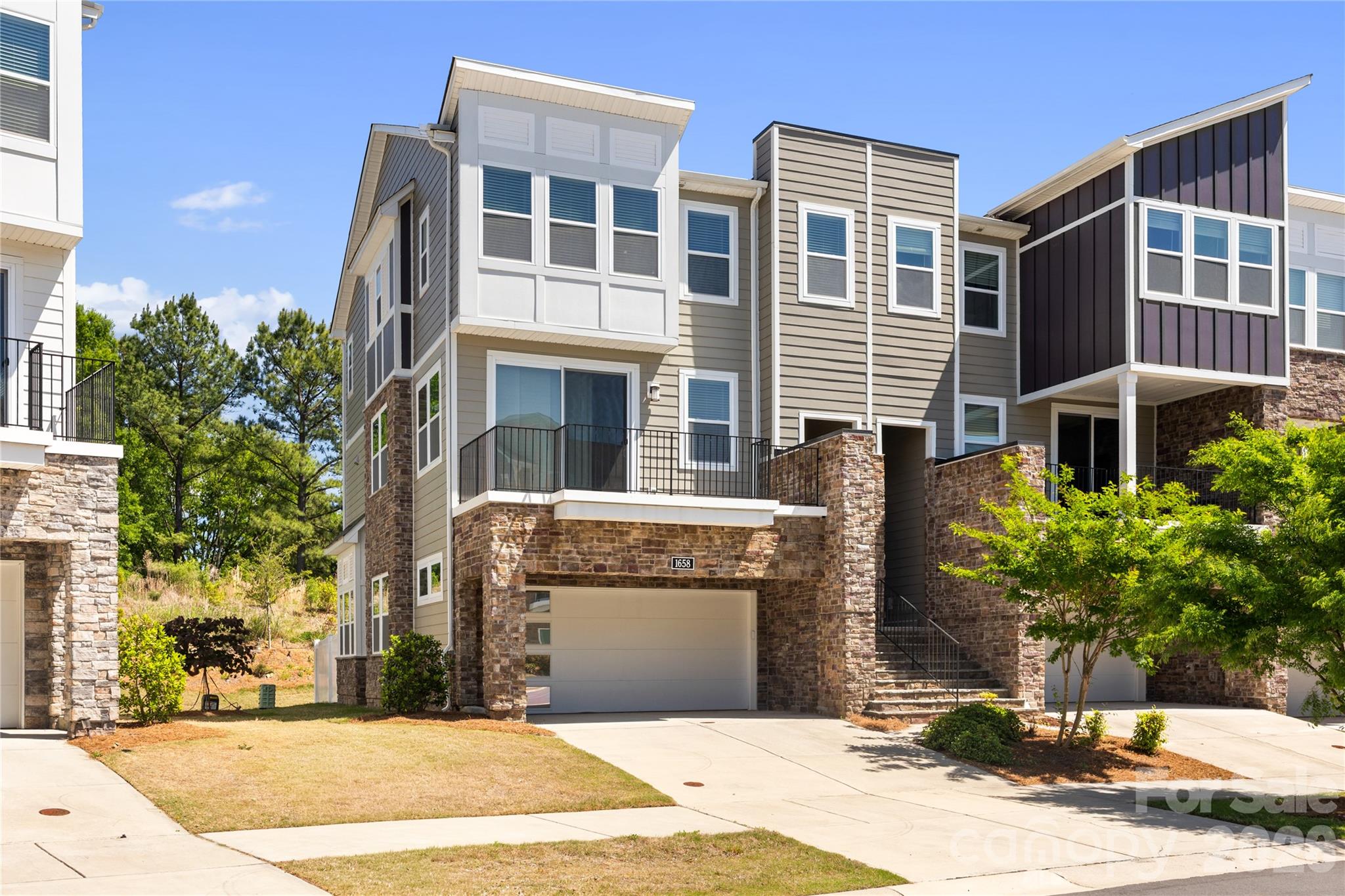Modern end-unit townhome surrounded by trees and natural light—better than new and minutes from I-485, I-77, and I-85.
Gorgeous townhome offering over 2,400 square feet. Surrounded by trees, this home is filled with natural light thanks to an abundance of windows and its private end-unit positioning.
This thoughtfully designed 4-bedroom, 3 full and 1 half bath home features a versatile main-level guest suite complete with a full bath and private outdoor sitting area—perfect for visitors or multi-generational living.
The second level showcases an open-concept layout ideal for entertaining, highlighted by a gourmet kitchen with a large island, quartz countertops, high-end cabinetry, and built-in appliances. The kitchen flows seamlessly into the dining area and spacious family room, along with a convenient powder room. Enjoy indoor-outdoor living with two decks featuring oversized sliding glass doors that flood the space with light.
Upstairs, the third level offers a spacious primary suite along with two additional bedrooms and a full bath, providing comfortable and functional living space.
Additional features include a 2-car garage with extra storage. 
Enjoy low-maintenance living with resort-style community amenities including a pool, clubhouse, and scenic walking trails—all while being conveniently connected to everything Charlotte has to offer