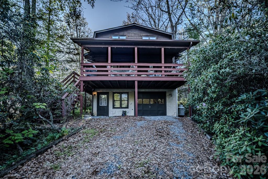 Charming log home nestled in the heart of Linville Land Harbor with warm wood floors and an inviting mountain feel throughout. This great room floor plan features a cozy gas fireplace for enjoying cool High Country evenings. The home offers a bedroom and bath on each level, providing comfort and flexibility for family and guests. Step outside to a covered deck for relaxing and taking in the natural surroundings. Offered partially furnished for added convenience. Additional features include a single-car garage and ample parking on both sides of the home.
Located in Linville Land Harbor, known for its exceptional amenities and vibrant lifestyle. Residents enjoy golf, tennis, fishing, hiking, swimming, and a wide variety of social activities and clubs . Community services include water, sewer, trash pickup, cable, and Wi-Fi, along with a 24-hour dedicated police department for peace of mind . Spend summer evenings at the Patio Grill enjoying seasonal live music and gathering with friends and neighbors.