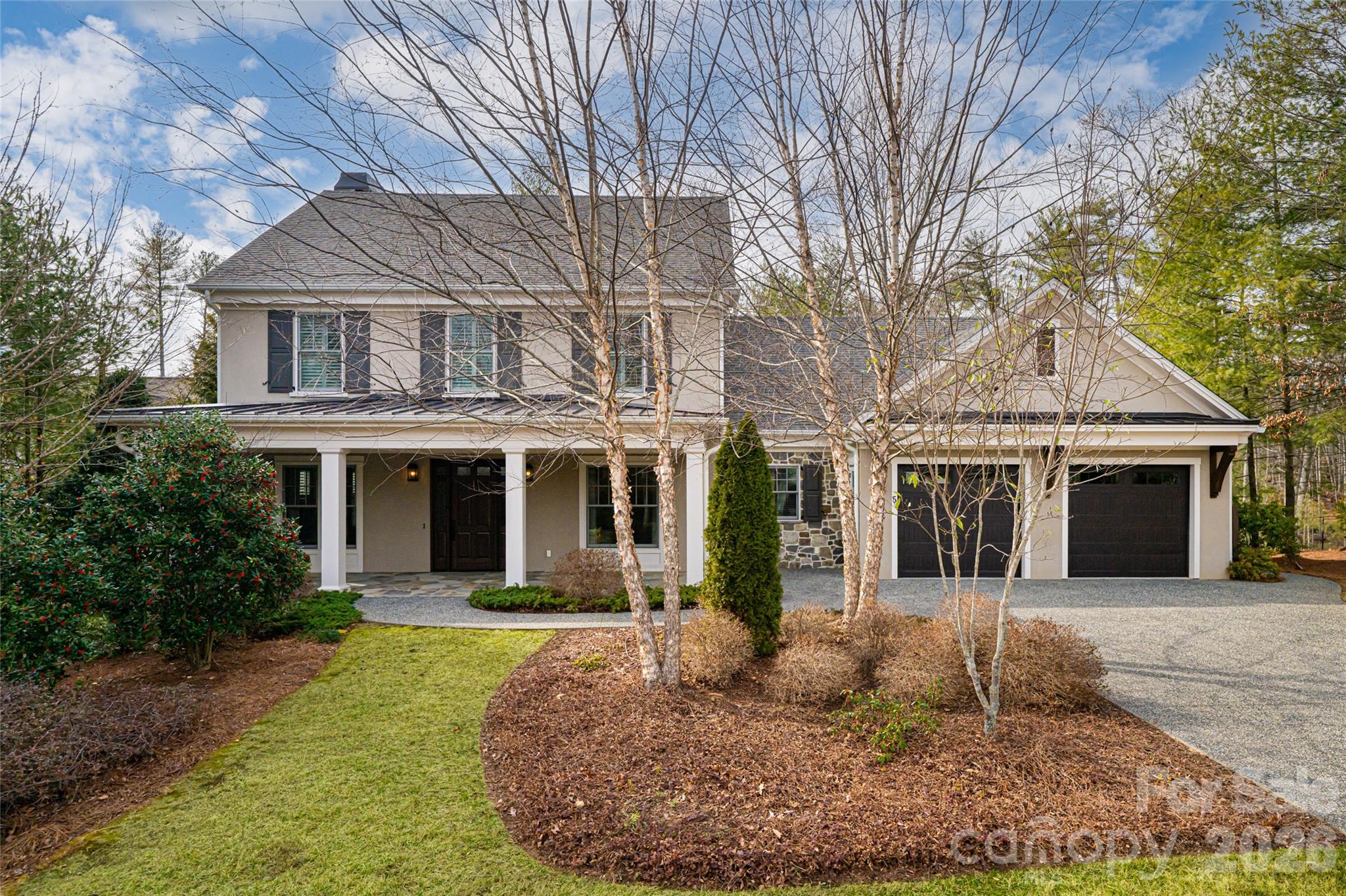 Designed for effortless elegance and elevated living, this exceptional residence in The Ramble Biltmore Forest is a masterful expression of light, proportion and refined craftsmanship. A gracious, flowing floor plan unfolds with intention, where expansive windows invite natural light to dance across rich hardwood floors and bespoke architectural details. At the heart of the home, the living room is anchored by a striking stone mantel fireplace, sculptural and inviting, creating a warm focal point for intimate evenings or grand entertaining. The chef’s kitchen, seamlessly open yet thoughtfully defined, is appointed for beauty and performance, offering generous workspace and effortless connection to living and breakfast areas. The main level is curated for comfort and convenience, featuring a serene owner’s suite designed as a private sanctuary, a distinguished office for inspired productivity, and a dining room adorned with custom cabinetry that balances artistry and utility. An elevator provides seamless access to all levels, ensuring ease of living without compromise. Throughout, tailored built-ins enhance the home’s aesthetic while offering purposeful storage solutions. Upstairs, four well-proportioned bedrooms and two full baths offer welcoming accommodations for family and guests alike, complemented by a spacious storage room for added versatility. Every finish has been selected with discernment, blending timeless style with modern comfort. Outdoors, a covered front porch sets a gracious tone of arrival, while a screened rear porch and adjoining deck overlook a mature, fenced backyard, an idyllic setting for quiet mornings or alfresco gatherings beneath the canopy of established trees. Residents of this distinguished community enjoy an unparalleled lifestyle with access to a wellness center, resort-style saline pool, pickleball and tennis courts, bocce, parks, scenic trails and 24-hour gated security, an extraordinary offering where privacy, recreation and natural beauty exist in harmonious balance.