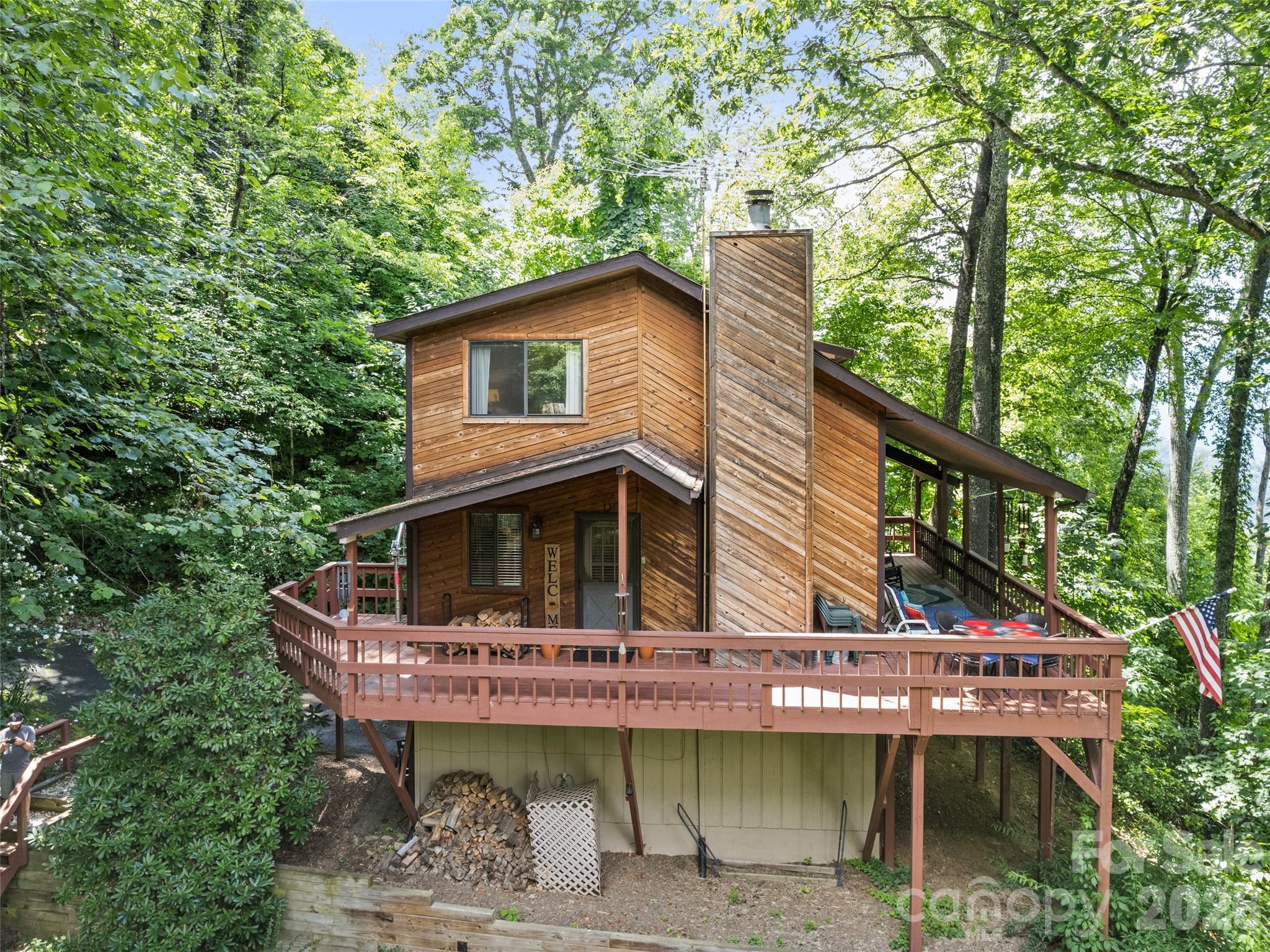 Just listed! Welcome to this awesome new "HEAVEN ON EARTH PROPERTY".  You must see and experience the beautiful long range mountain views of this awesome property. Open floor plan that incorporates lots of glass and a stone wood burning fireplace. Home is located on over an acre of private land with paved access. Very clean and well maintained. Current owners never had on a rental program but it has been on rental programs by previous owners. Short and long term rentals are allowed! Hello Vacation rental by owner and AIRBNB! Home is being sold furnished and should be ready to enjoy and rent if need be. Contemporary architecture with a large wrap around porch enhance the unique style of this lovely mountain home. While the interior does have a nice even flow, don't miss the opportunity to experience the quiet and serenity of the outdoors and what nature has to offer including many birds and natural habitat the Western Mountains provide. Priced aggressively. PERFECT!