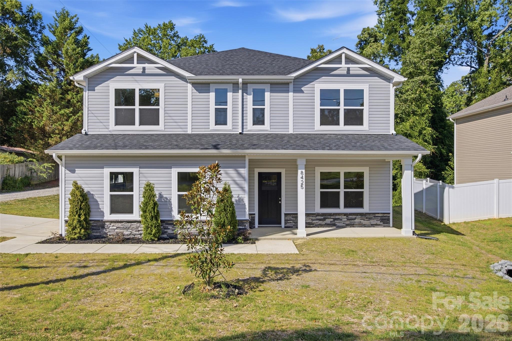 Discover this beautifully crafted new-construction 5-bedroom, 3.5 bathroom home! This thoughtfully designed two-story home blends modern finishes, quality craftsmanship, and a functional layout ideal for today’s lifestyle. The main level features an open-concept living and dining area that flows seamlessly into the kitchen, creating an inviting space for everyday living and entertaining. A main-level bedroom offers flexibility for guests or multigenerational living. The chef-inspired kitchen showcases quartz countertops, shaker-style soft-close cabinetry, a classic subway tile backsplash, stainless steel appliances, and a spacious center island. Upstairs, the expansive primary suite offers a private retreat with generous closet space and a spa-inspired bathroom. Three additional bedrooms, a full guest bathroom, and a conveniently located laundry room complete the upper level. Located in an area with limited new-construction opportunities, this home offers convenient access to major thoroughfares, Uptown Charlotte, Charlotte Douglas International Airport, shopping, dining, and nearby outdoor amenities. Photos are of a previous build and may not reflect final finishes.