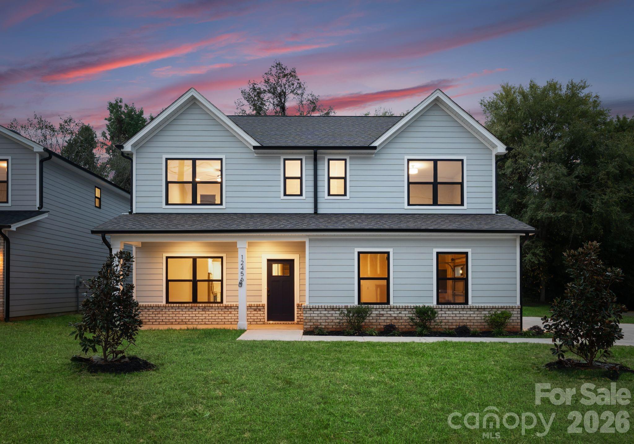 Discover this beautifully crafted new-construction 5-bedroom, 3.5 bathroom home! This thoughtfully designed two-story home blends modern finishes, quality craftsmanship, and a functional layout ideal for today’s lifestyle. The main level features an open-concept living and dining area that flows seamlessly into the kitchen, creating an inviting space for everyday living and entertaining. A main-level bedroom offers flexibility for guests or multigenerational living. The chef-inspired kitchen showcases quartz countertops, shaker-style soft-close cabinetry, a classic subway tile backsplash, stainless steel appliances, and a spacious center island. Upstairs, the expansive primary suite offers a private retreat with generous closet space and a spa-inspired bathroom. Three additional bedrooms, a full guest bathroom, and a conveniently located laundry room complete the upper level. Located in an area with limited new-construction opportunities, this home offers convenient access to major thoroughfares, Uptown Charlotte, Charlotte Douglas International Airport, shopping, dining, and nearby outdoor amenities. Photos are of a previous build and may not reflect final finishes.