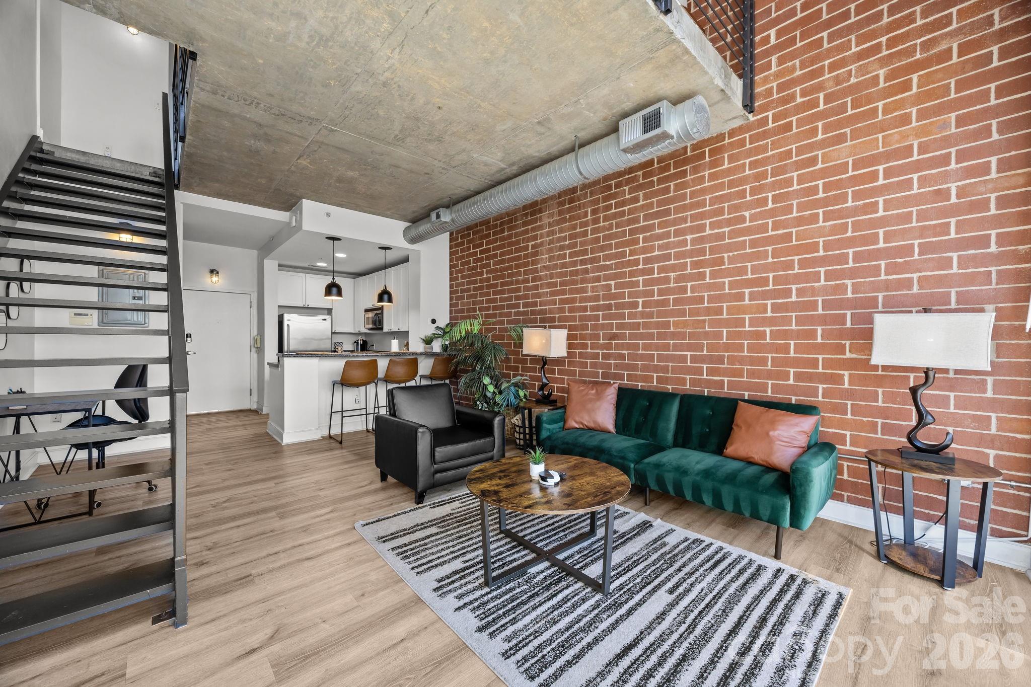 ** MOTIVATED SELLERS **

Welcome to 710 W Trade Street #314 — a stylish 1-bedroom, 1-bath residence in the highly sought-after Gateway Lofts, perfectly positioned on the edge of Uptown in vibrant Charlotte.

This light-filled loft beautifully blends industrial character with modern comfort. Soaring ceilings, oversized windows, and an open-concept layout create an airy, inviting atmosphere that feels both spacious and warm. The kitchen flows seamlessly into the main living area, making it ideal for entertaining friends or enjoying a quiet evening overlooking the city energy below. The generous bedroom provides a peaceful retreat, while smart design throughout ensures effortless everyday living.

Step outside and experience one of Charlotte’s most walkable and connected locations. Enjoy morning runs, dog walks, or weekend relaxation at Frazier Park, just moments away. Take in skyline views and community events at Romare Bearden Park, or catch the excitement of game day at Bank of America Stadium, all within easy reach. Greenways, green space, dining, breweries, and entertainment are truly at your doorstep.

Commuters will appreciate immediate access to I-77, I-277, and Uptown’s business and financial districts, making daily travel simple and efficient. With easy access to the light rail, trolly, and bus station, getting around the city is a breeze. Whether you work nearby or travel frequently, this location keeps you seamlessly connected.

Residents of Gateway Lofts enjoy secure building access, controlled parking, elevator convenience, and a welcoming community atmosphere that perfectly complements the lock-and-leave lifestyle. It’s low-maintenance living without sacrificing excitement or accessibility.

With its prime Uptown location and strong rental appeal, this unit also presents an excellent investment opportunity. The walkability to parks, stadiums, dining, and transit makes it highly attractive for both long-term tenants seeking urban convenience and short-term renters visiting for business, events, or weekend getaways. Whether you’re looking to generate consistent monthly income or capitalize on Charlotte’s vibrant event calendar, 710 W Trade Street #314 offers flexibility and income potential.

If you’ve been searching for a home or investment that delivers character, convenience, and connection to everything Charlotte has to offer, 710 W Trade Street #314 is ready to welcome you.