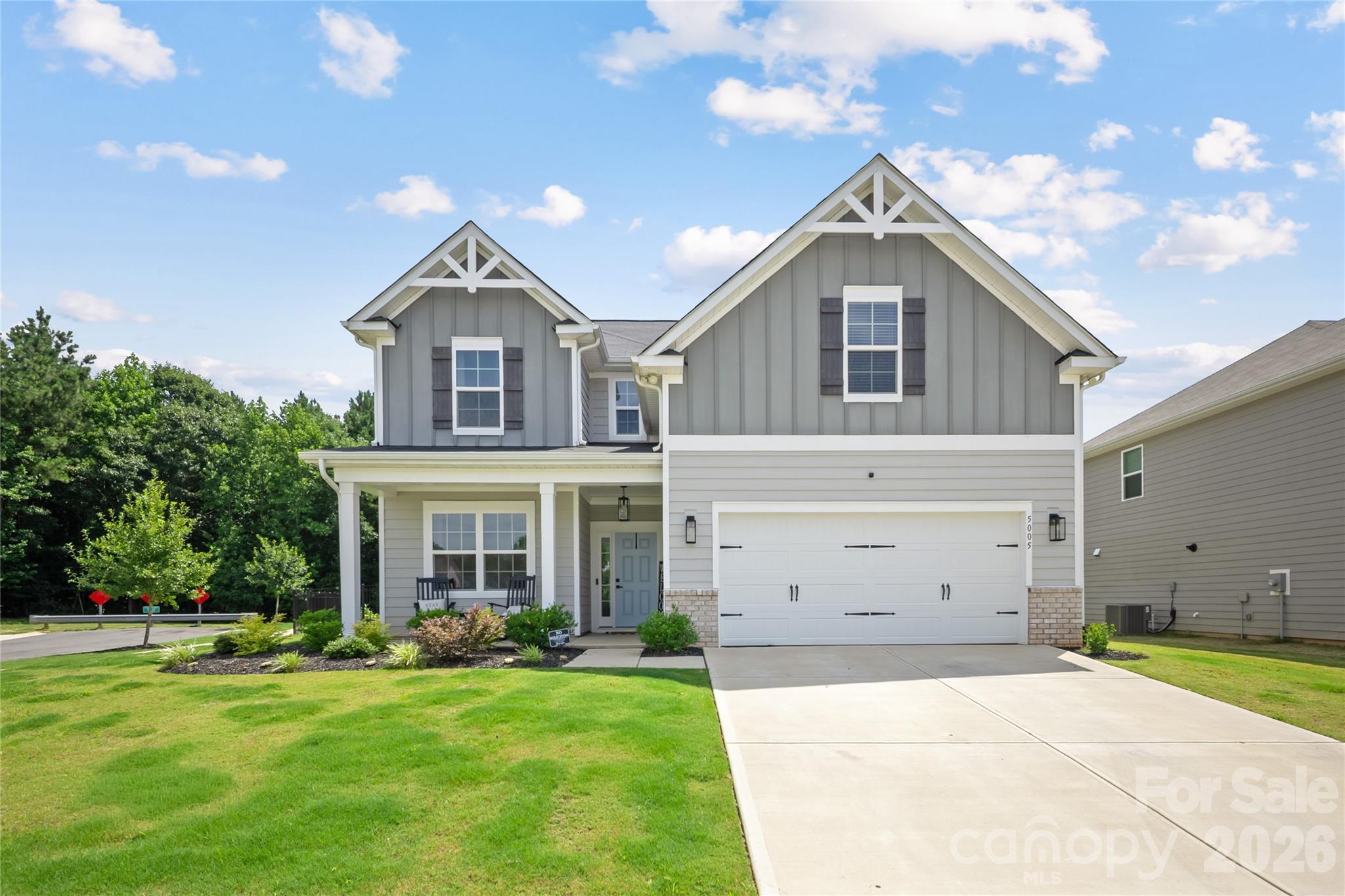 Situated on a premium corner lot with one of the largest fenced backyards in the community, this beautifully maintained 2023 home offers wooded views, a starter garden, and the perfect blend of modern living and flexible space. Inside, you'll find an open-concept floor plan featuring luxury vinyl plank flooring, a dedicated main-level home office, and a spacious living area that flows seamlessly into the gourmet kitchen with quartz countertops, stainless steel appliances, subway tile backsplash, abundant cabinetry, and an oversized island perfect for gathering. Upstairs, the spacious primary suite is complemented by two additional bedrooms and a finished flex room that can easily serve as a media room, second home office, playroom, home gym, or entertainment space. Step outside to your own backyard retreat featuring a covered patio and an extended concrete patio, providing plenty of room for grilling, outdoor dining, entertaining, or simply relaxing while enjoying the peaceful tree-lined backdrop. Conveniently located just minutes from I-485, shopping, dining, and Uptown Charlotte, this move-in-ready home offers the space, privacy, and versatility today's buyers are looking for.