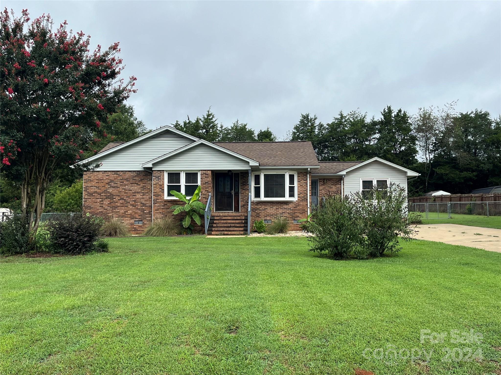 This one-story home, located in a quiet neighborhood with no HOA, is ready for new owners.  Featuring two bedrooms, two full baths, and a flex space with a closet that has been used as an office, it has so much potential for buyers.  With new flooring and HVAC in 2024, you can add your personal updates and make this house your next home. The two bathrooms have been updated with vanities and lighted mirrors and a tankless water heater has been installed.   A large fenced-in backyard with an above ground pool (that conveys as is) provides great space for many outdoor activities and two storage buildings will remain.  Come see what this home offers you!