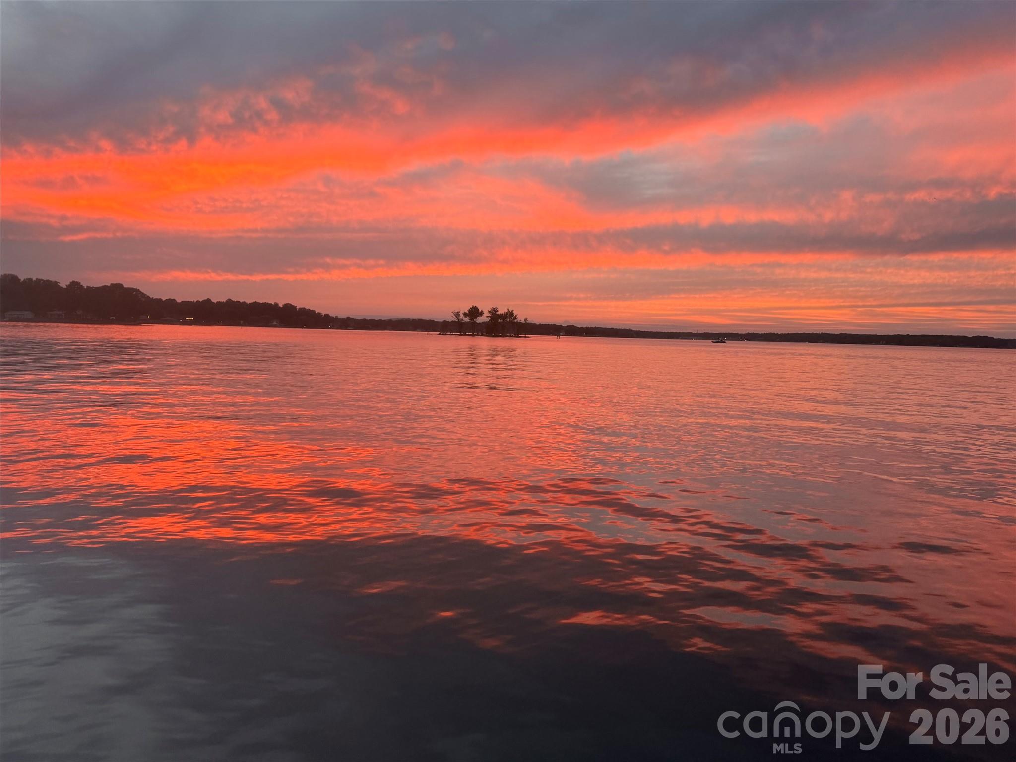 Unlock the ultimate Lake Norman lifestyle with this incredible waterfront property located in Denver on Windward Point Peninsula! Situated on a prime lot, this solid 1971 full-brick cottage features big main channel water views, a high-utility 2-bedroom, 1.5-bathroom layout, serving as the perfect canvas for your dream lakehouse renovation or a premier custom rebuild.
Step inside to find endless potential, or head straight out to the massive lakeside deck—the absolute perfect spot for entertaining, watching sunsets, and enjoying panoramic water views.
The true crown jewel of this property is its exceptional, grandfathered waterfront infrastructure. Skip the public lines with your own RARE private boat ramp—an irreplaceable asset that is incredibly difficult to permit on Lake Norman today. The property also features a private pier and floating dock, allowing you to live the lake life on day one (boat lift present but inoperative; conveys as-is).
Whether you choose to renovate this brick beauty into a weekend escape, a lucrative short-term rental, or explore modern custom building options utilizing space-saving engineered septic systems, the value is entirely in the dirt and the premium shoreline infrastructure. Highly suggest an early evening tour to capture the breathtaking sunset. Schedule your showing today and bring your vision!