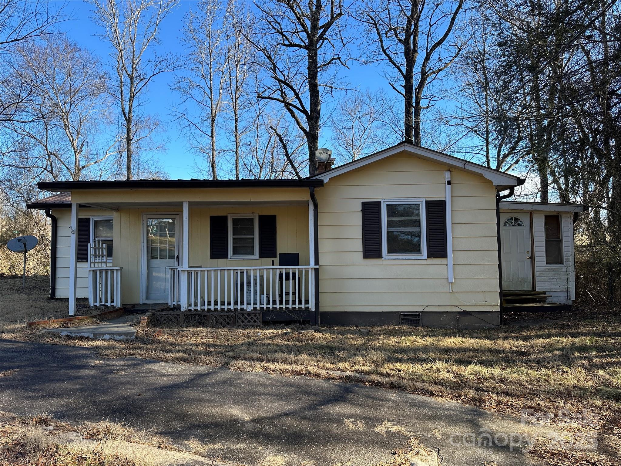 Come live the quiet Country life as this bungalow has what your looking for.  Almost an acre of land and easy to maintain.  Well maintained house and offers alot for this price.  Great rocking chair covered front porch, metal roof, 30 mins from charlotte, 20 mins to statesville and 45 to asheville.  Wide lot with circular drive, storage shed, and 12 X 24 wired shop building with skylights.  Stop paying those high rents and come view this while you can.