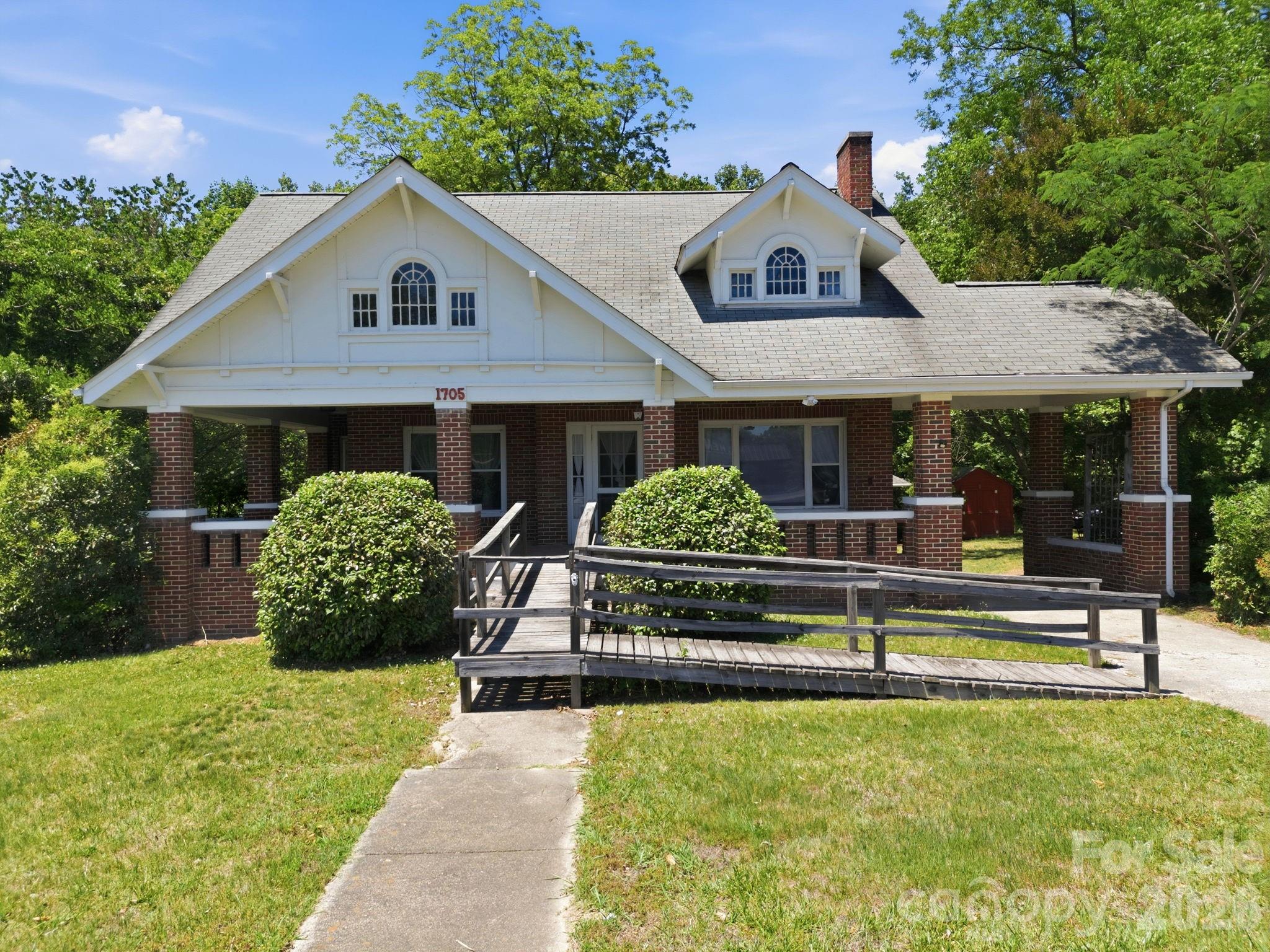 This one-of-a-kind property offers timeless character, generous living space, and endless possibilities. Built in the early 1900s, the home features spacious rooms, tall interior ceilings, detailed trim work, and original wood flooring throughout much of the residence. 

With multiple living areas and flexible room options, the layout can easily accommodate larger households, guest space, home offices, or hobby areas.

The home offers over 3,200 square feet spread across two levels, along with an unfinished lower level perfect for additional storage or future customization. One of the main-level rooms provides direct access to the expansive covered front porch, creating the perfect spot for morning coffee or evening relaxation.

Outside, the property includes a covered parking area, detached garage, and an additional separate lot that creates even more opportunity for future use or expansion. 

Positioned with commercial-friendly zoning, this property could serve a variety of purposes including residential living, office use, guest accommodations, short-term rental opportunities, and more. Properties with this much flexibility and potential do not come around often.

Seller is offering $7,500 in seller concessions with an acceptable offer!

Schedule your private tour today!