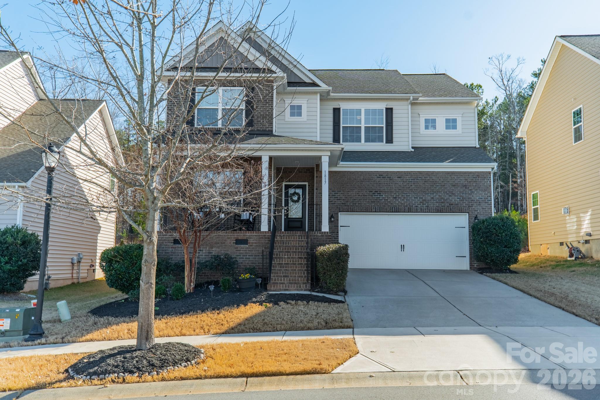 Tucked into the highly sought after Waterside at the Catawba community in Fort Mill, this beautiful 5 bedroom, 3.5 bath home offers more than 3000 square feet of thoughtfully designed living space with a warm, charming feel throughout. Welcoming you with a rocking chair front porch, the main level opens to a private study and formal dining room. The luxurious kitchen features a gas range, walk-in pantry and a large breakfast area. It transitions easily to the bright, airy living room complete with custom built-ins, creating an inviting space for everyday living and easy entertaining. 

Upstairs, the spacious primary suite offers a quiet retreat, while the additional 3 bedrooms provide plenty of room for family and guests. The fifth bedroom easily adapts into a bonus/media room, or flex space, allowing the home to grow and change with your needs.

Evenings are made for grilling on the porch or gathering with friends around the backyard fire pit space, with plenty of room to relax and unwind in this private, tree-lined backyard. The spacious pocket park located just steps from the front door is perfect for even more outdoor play with neighbors and friends. Life in Waterside at the Catawba includes access to resort-style amenities including the clubhouse, fitness center, swimming pools, walking trails, and playgrounds. Just minutes from shopping, dining, and award winning Fort Mill schools, this home delivers the lifestyle you have been searching for!